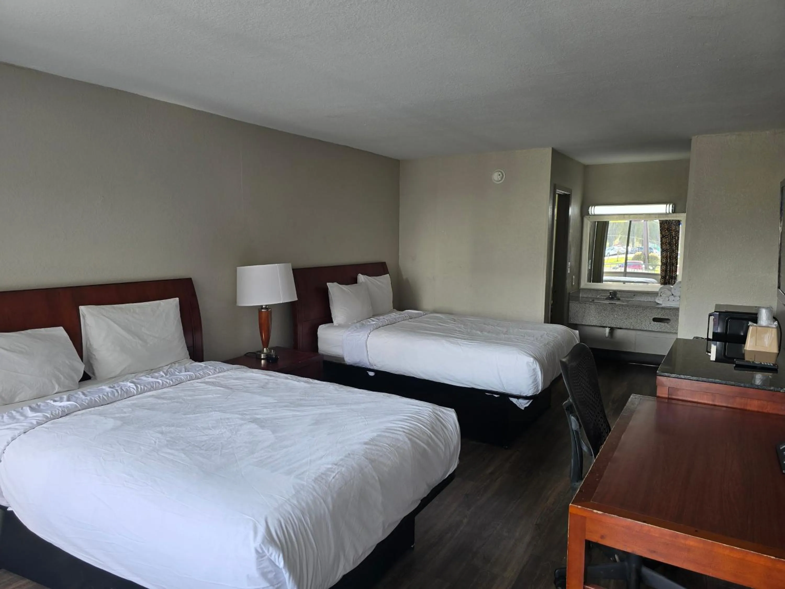 Bedroom in Days Inn by Wyndham Raleigh South