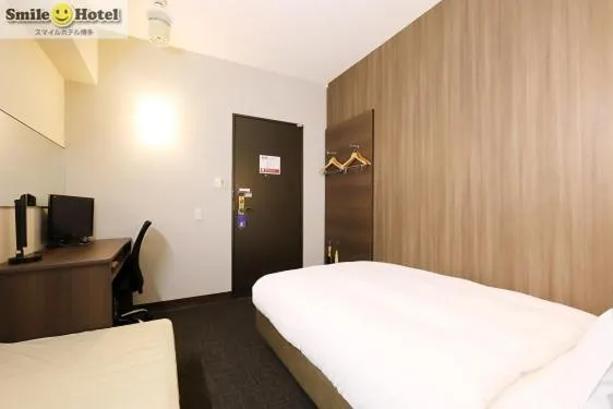 Bedroom, TV/Entertainment Center in Smile Hotel Hakata