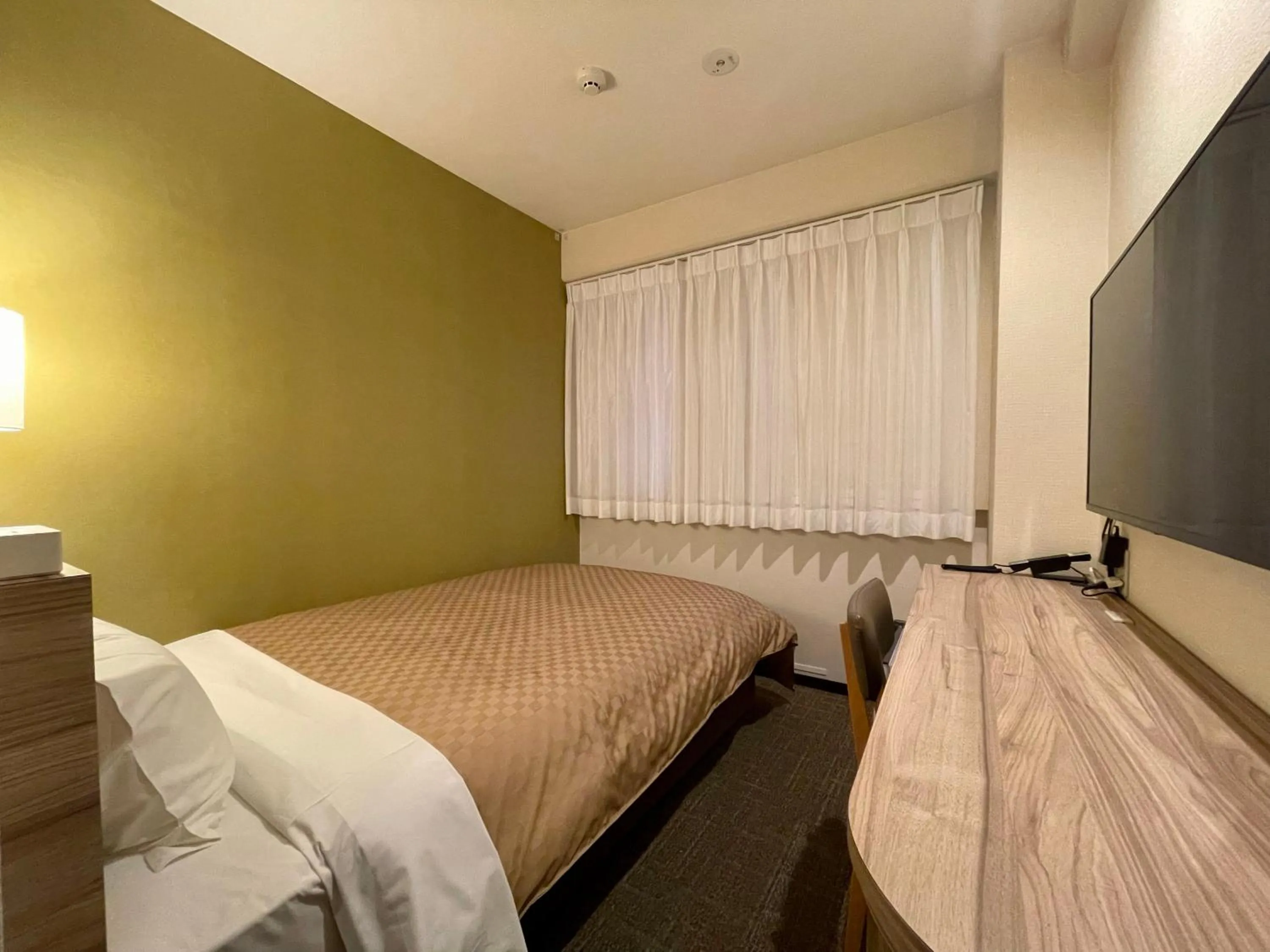 Bed in Kusatsu Daiichi Hotel