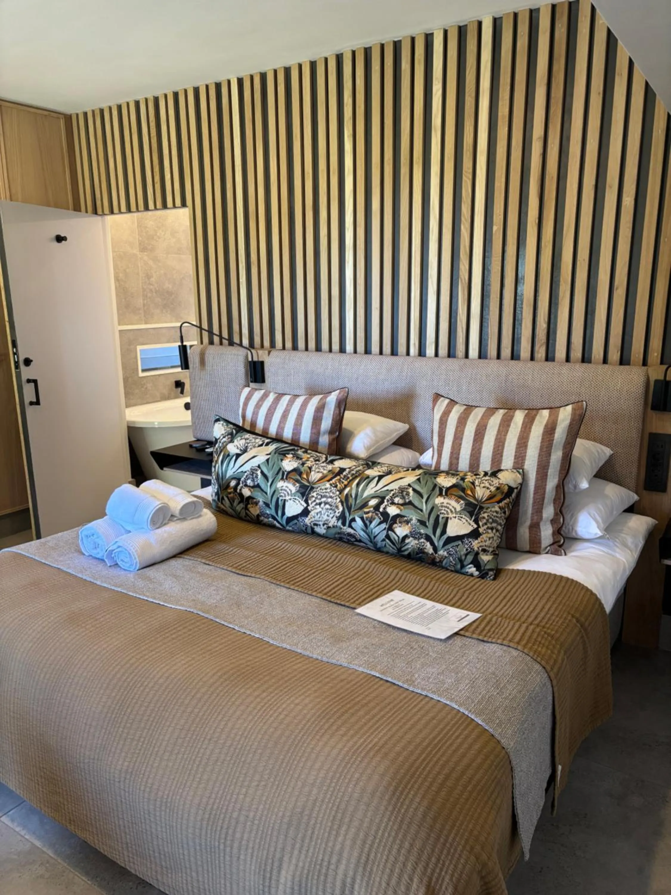 Bed in Dolphin Dunes Guesthouse