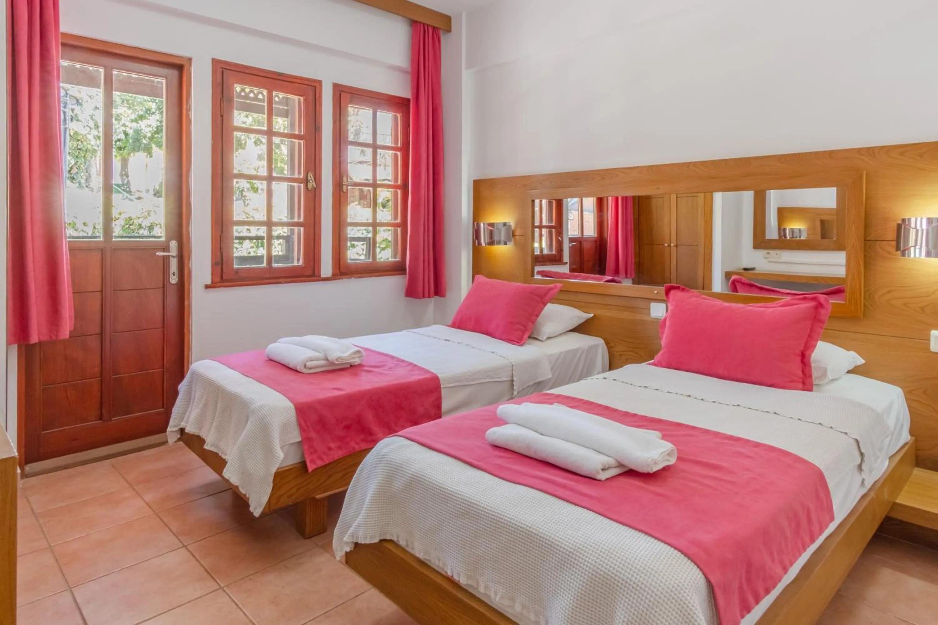 Bed in Club Pink Palace Hotel