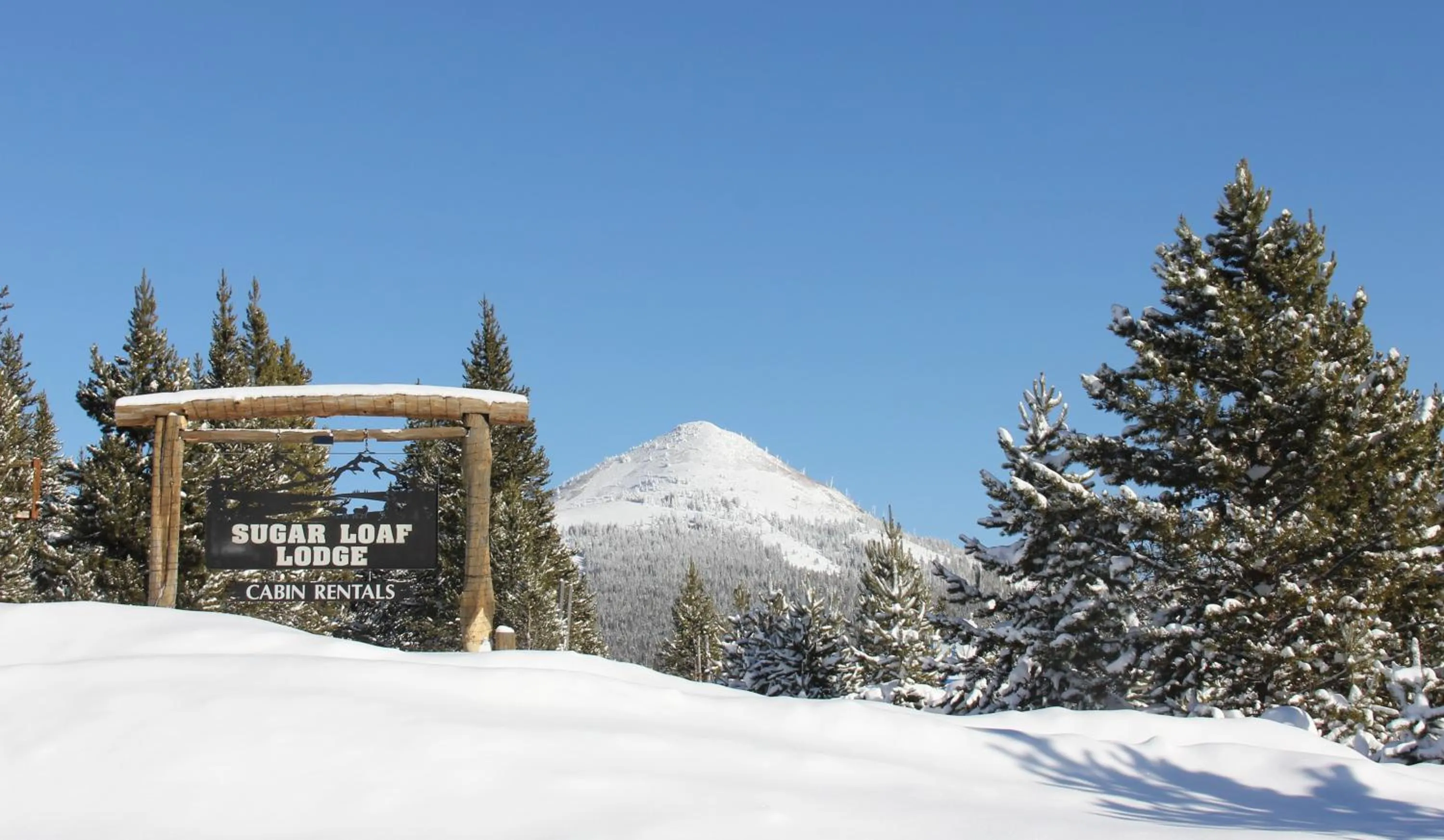 Property logo or sign in Sugar Loaf Lodge & Cabins