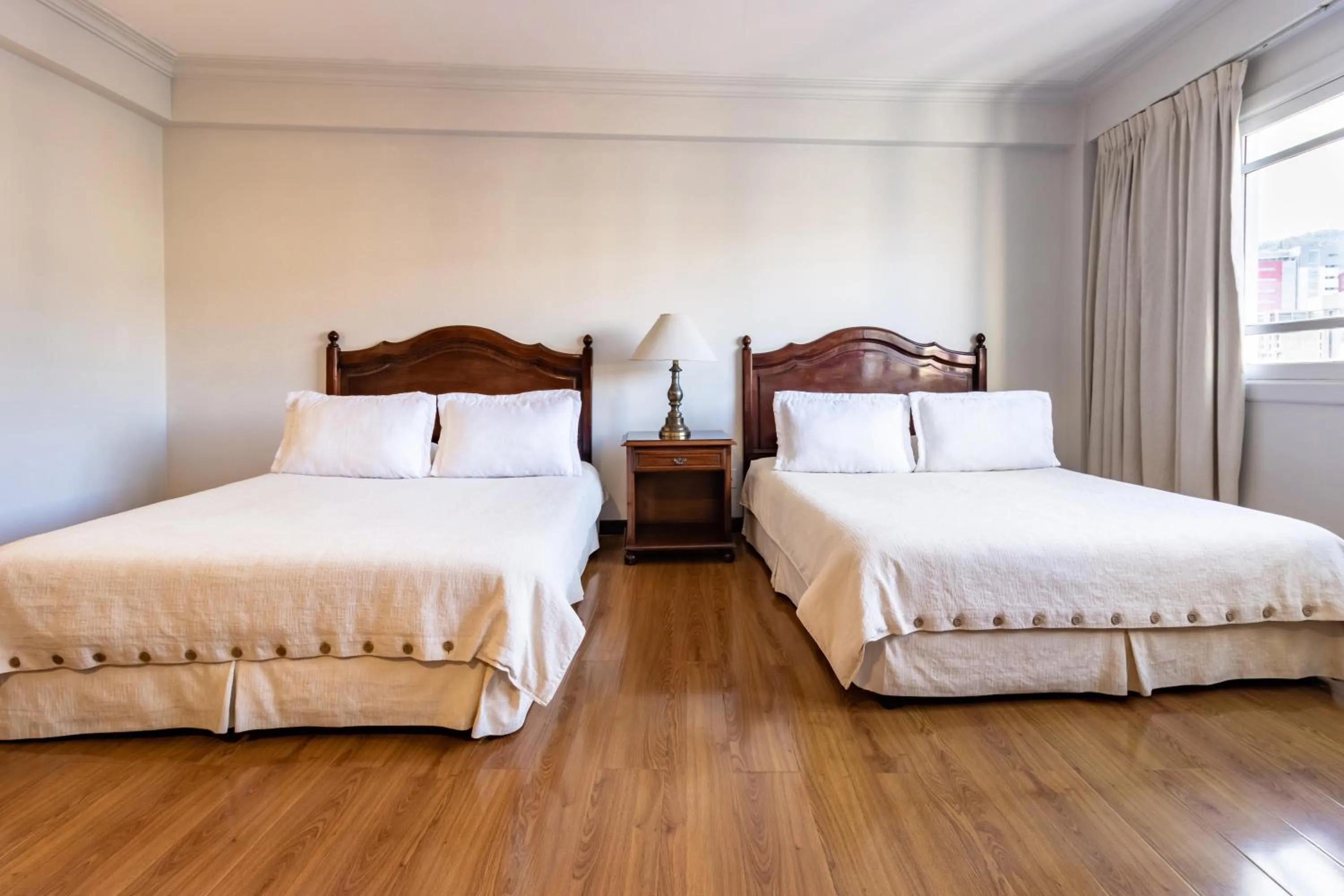 Bed in El Rey Palace Hotel