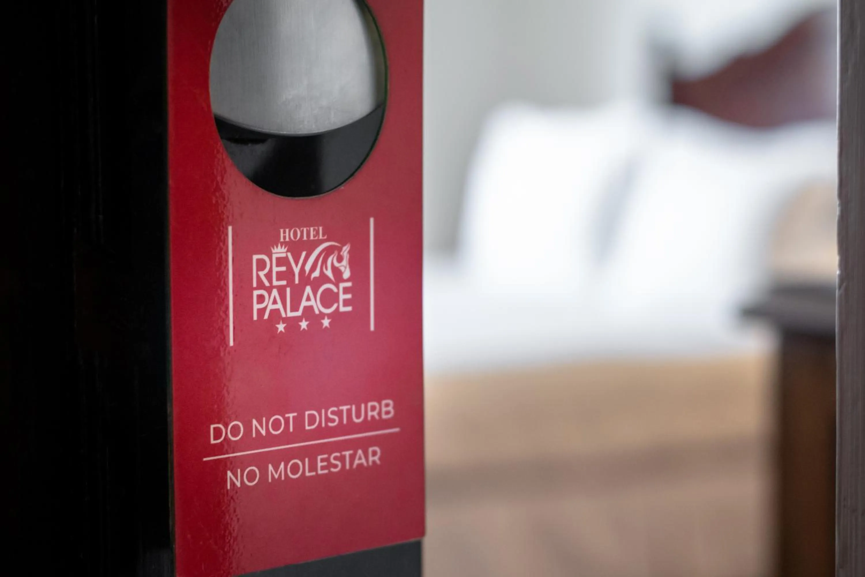 Property logo or sign, Bed in El Rey Palace Hotel