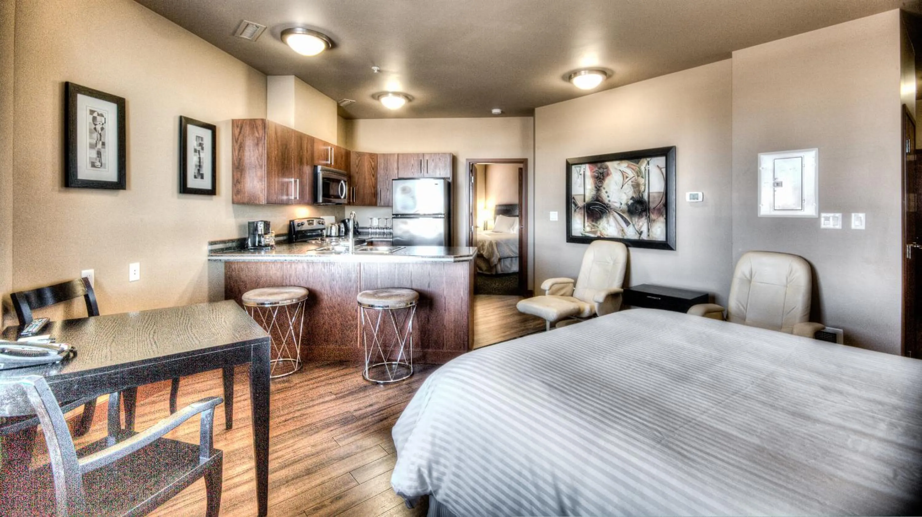 Kitchen or kitchenette in Grand Inn & Residence- Grande Prairie