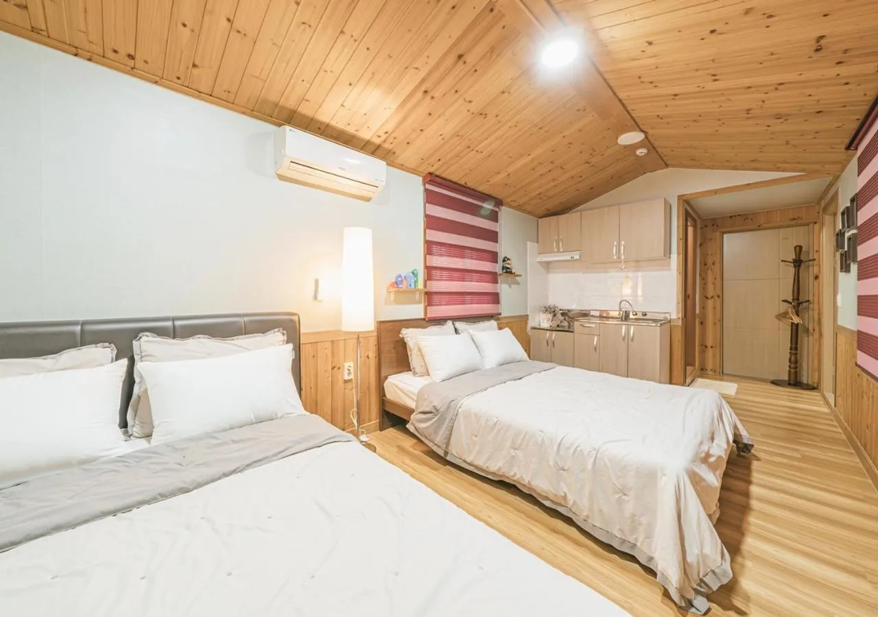 Bed in Jeju Haepoomdal Pension