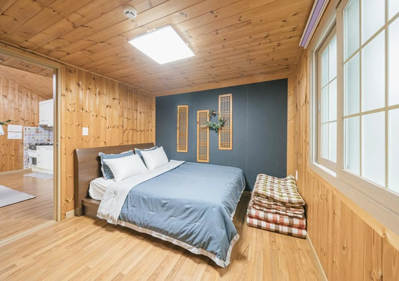 Bed in Jeju Haepoomdal Pension