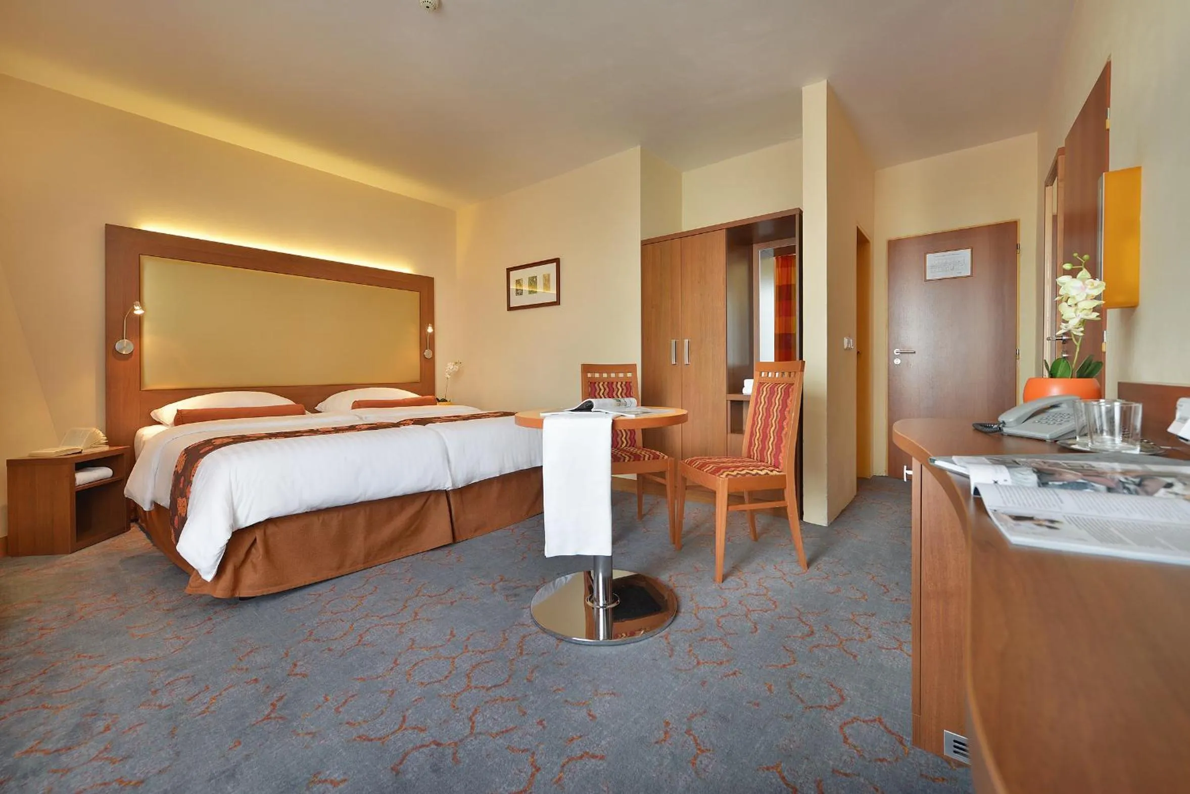 Bed in Maxmilian Lifestyle Resort