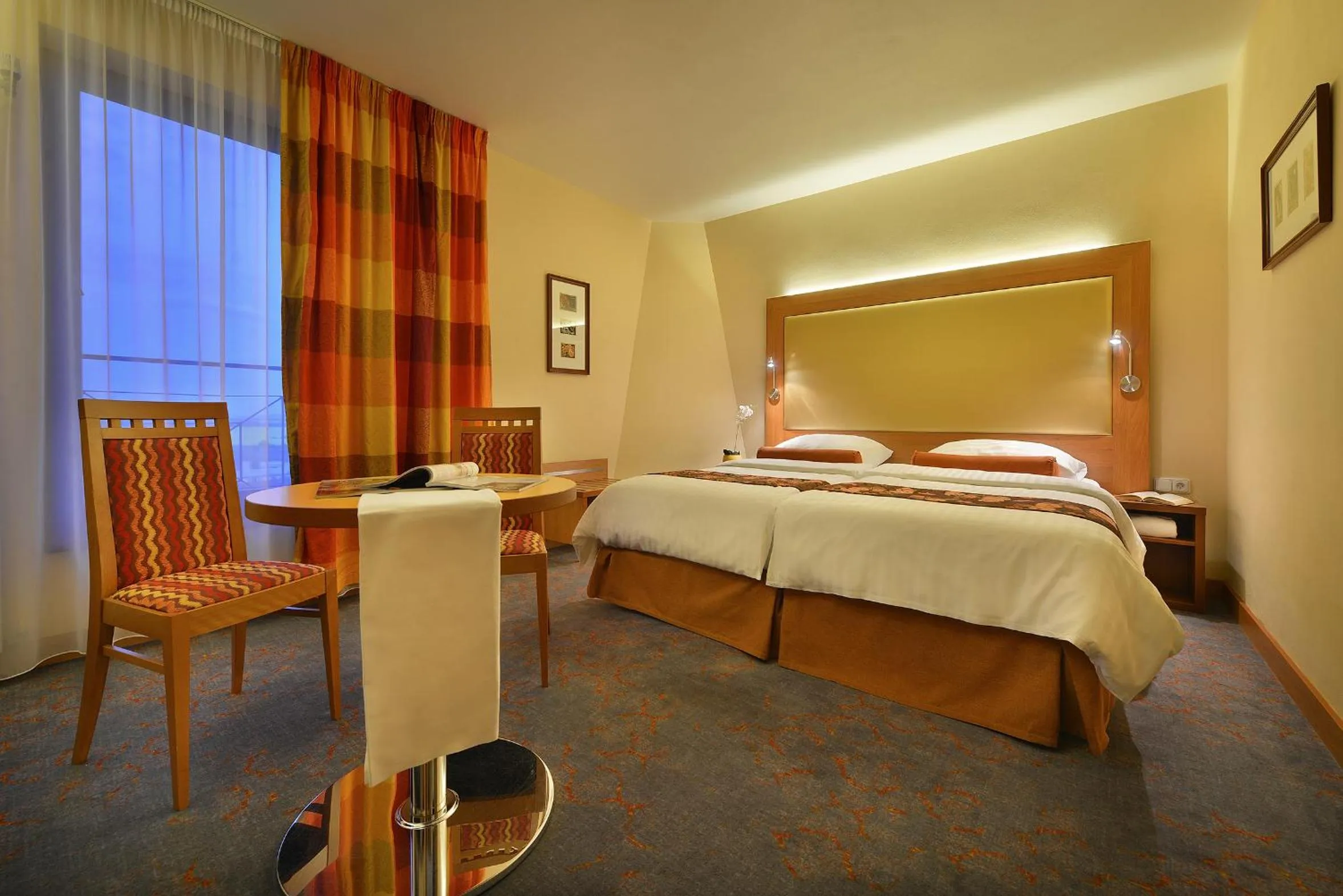 Bed in Maxmilian Lifestyle Resort