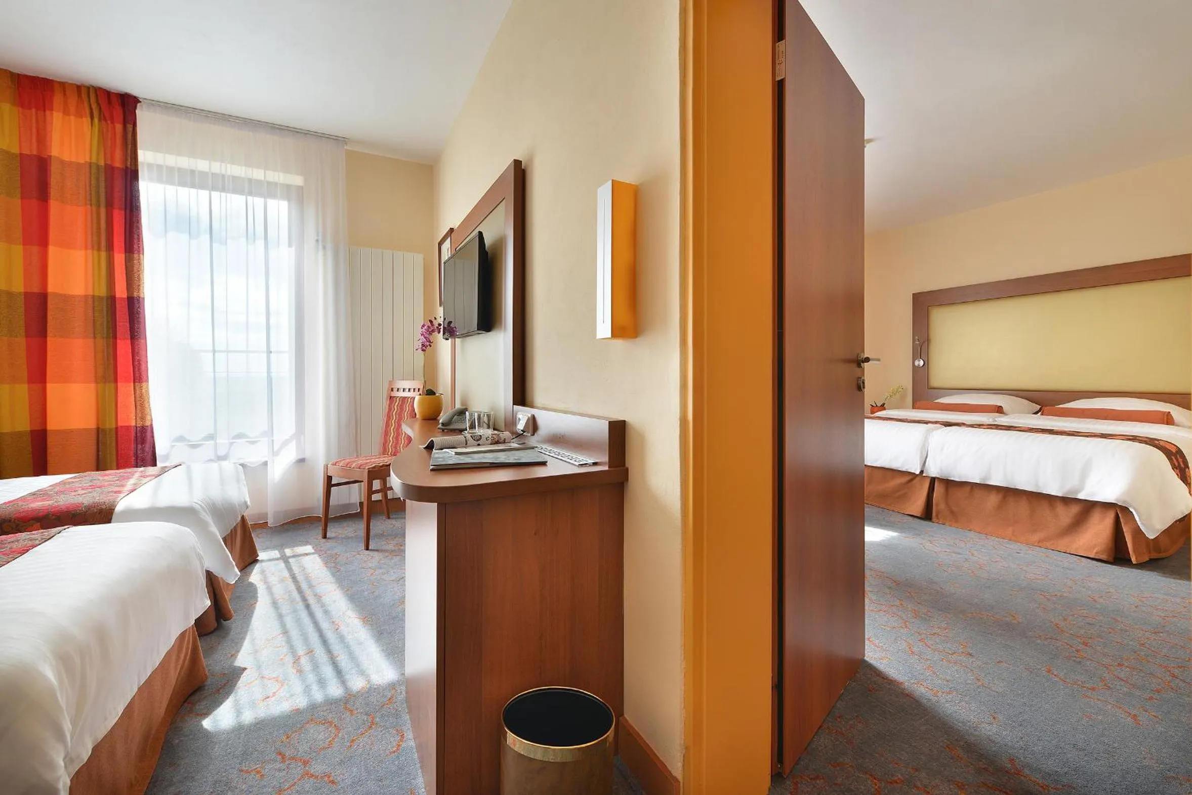 Bed in Maxmilian Lifestyle Resort