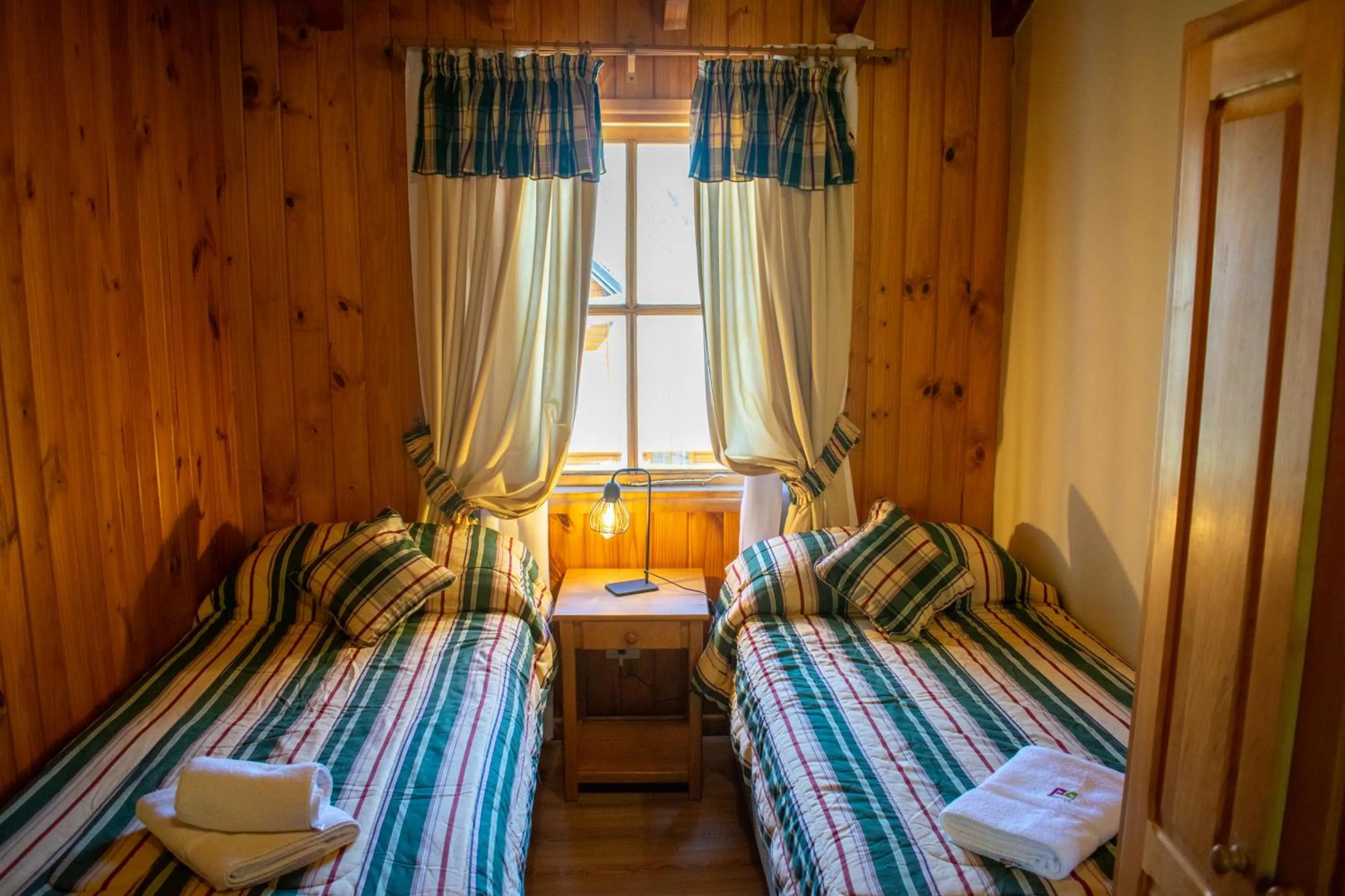 Bed in Hosteria y Cabañas Posada Quinen