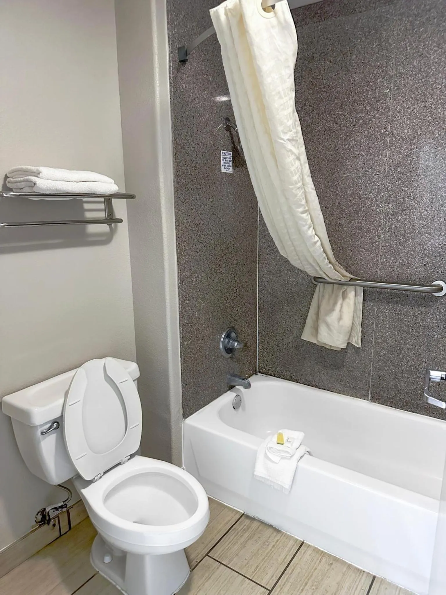 Bathroom in Days Inn & Suites by Wyndham Opelousas