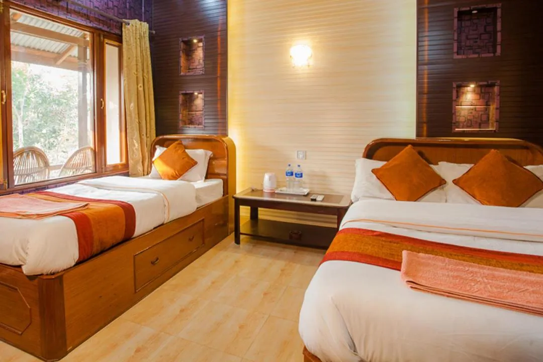 Bedroom, Bed in Chitwan Forest Resort with swimming pool , Chitwan National Park