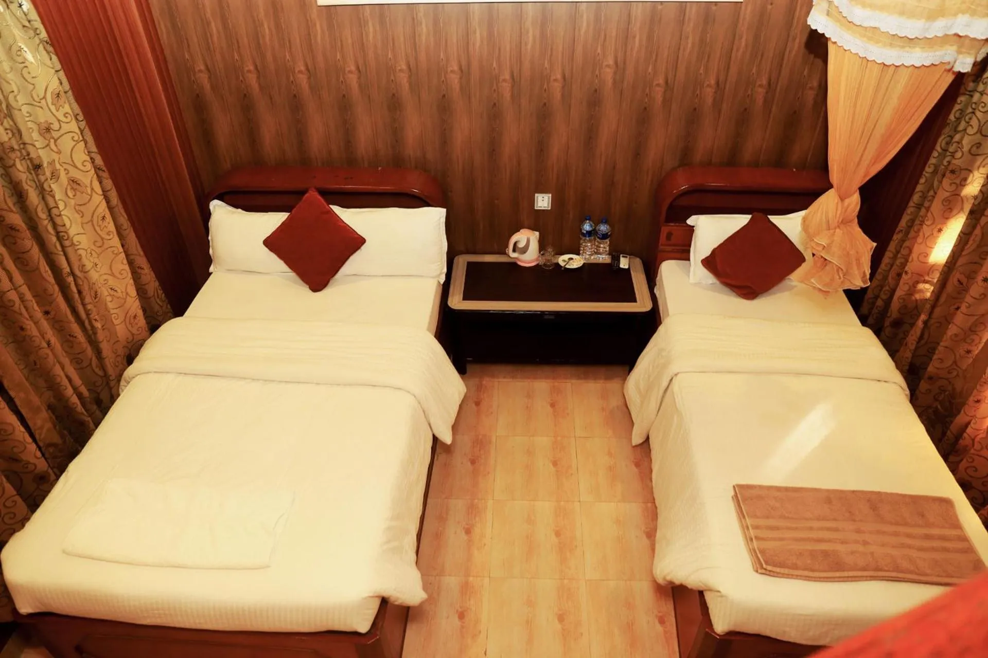 Bed in Chitwan Forest Resort with swimming pool , Chitwan National Park