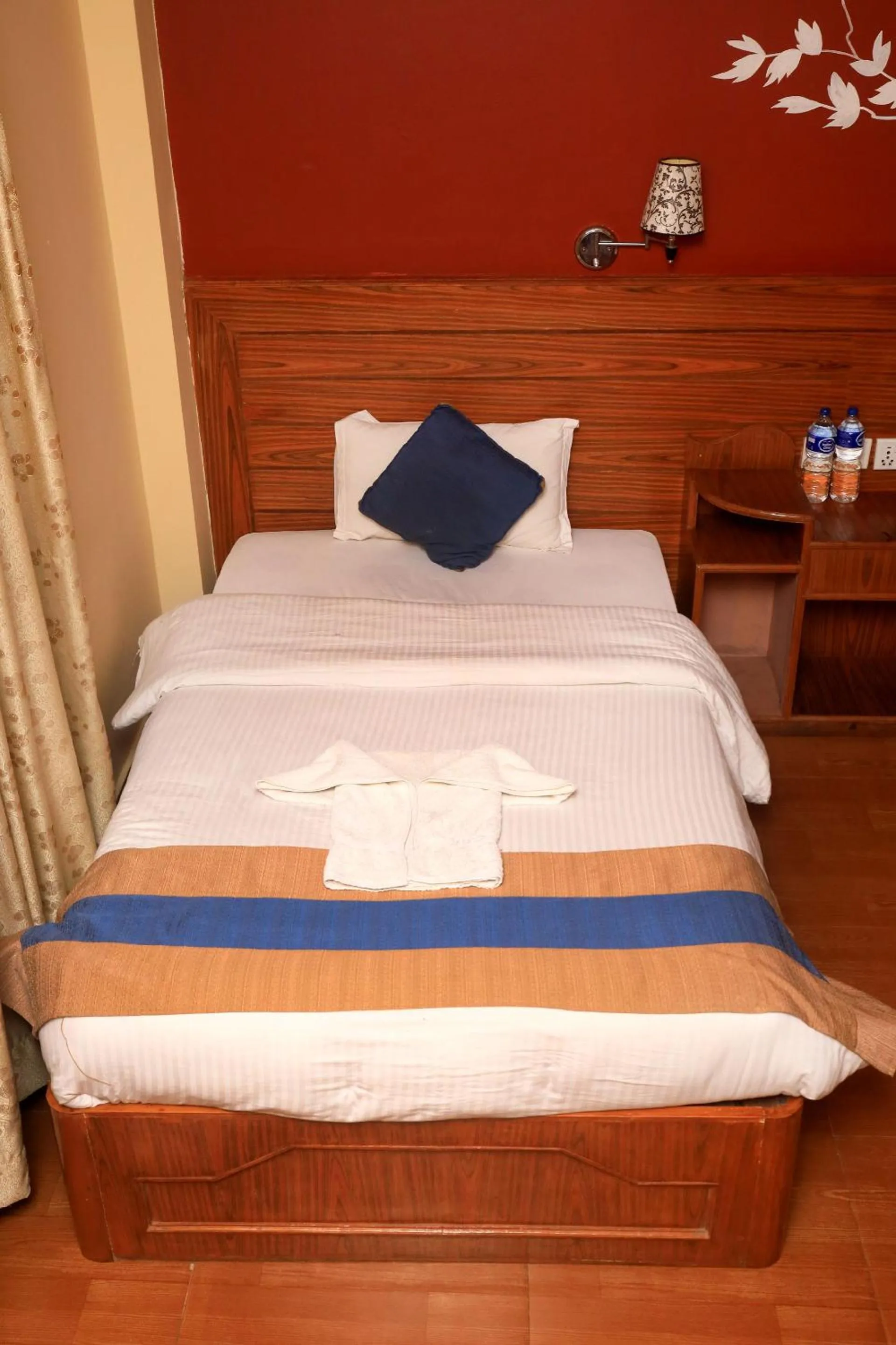 Bed in Chitwan Forest Resort with swimming pool , Chitwan National Park