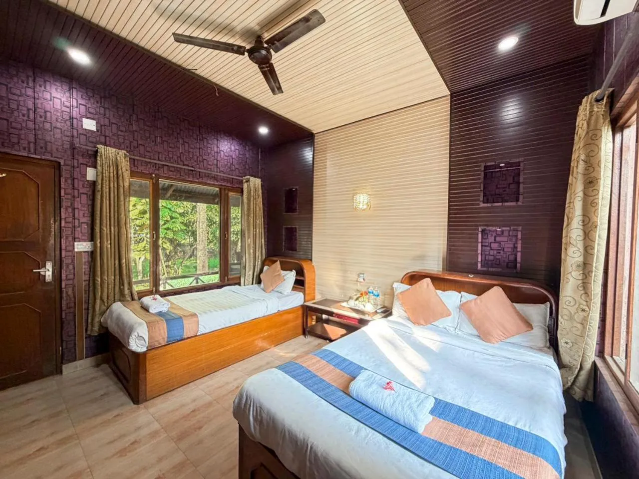 wardrobe, Bed in Chitwan Forest Resort with swimming pool , Chitwan National Park