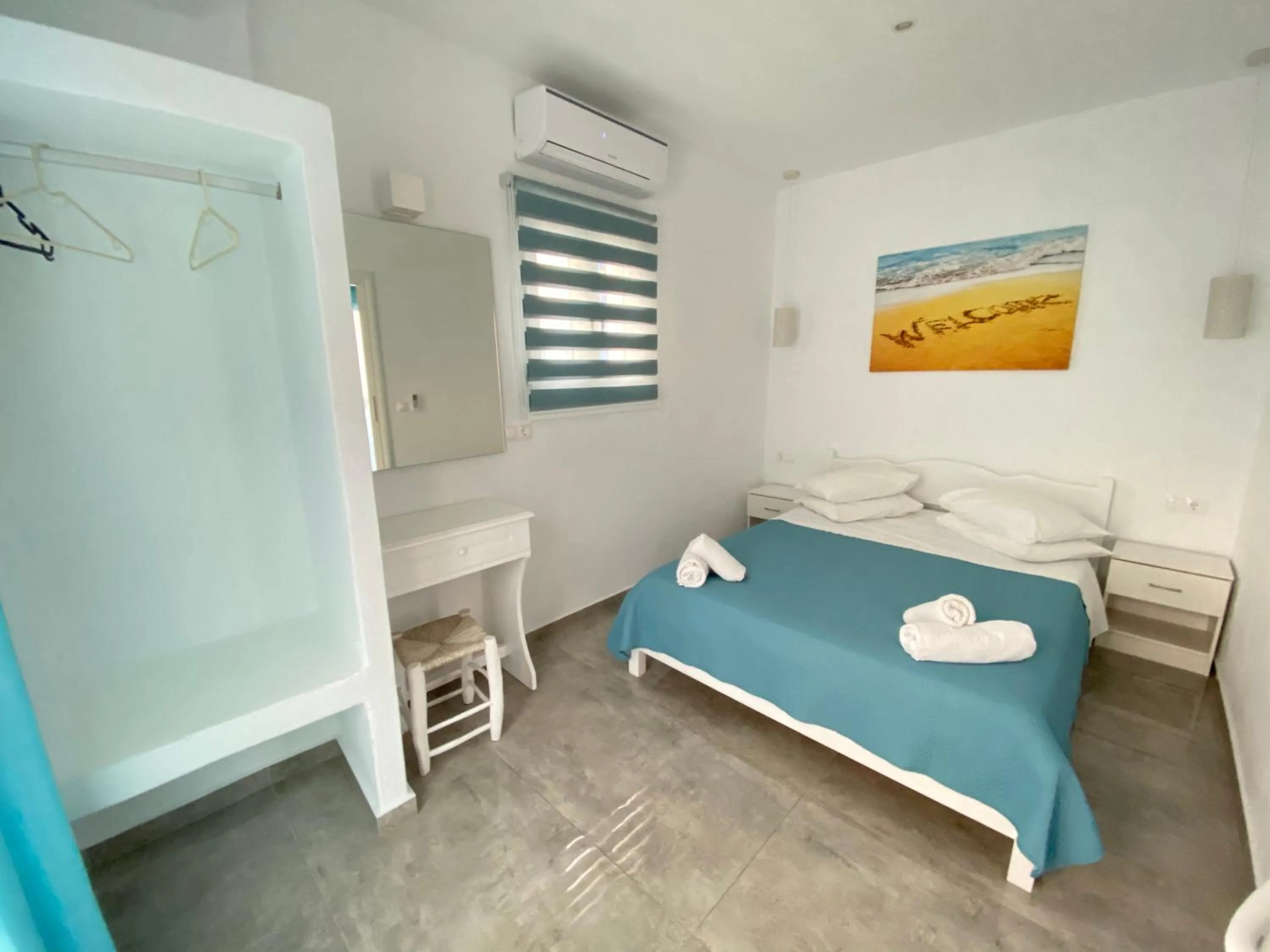 Bed in Anemos Hotel & Apartments