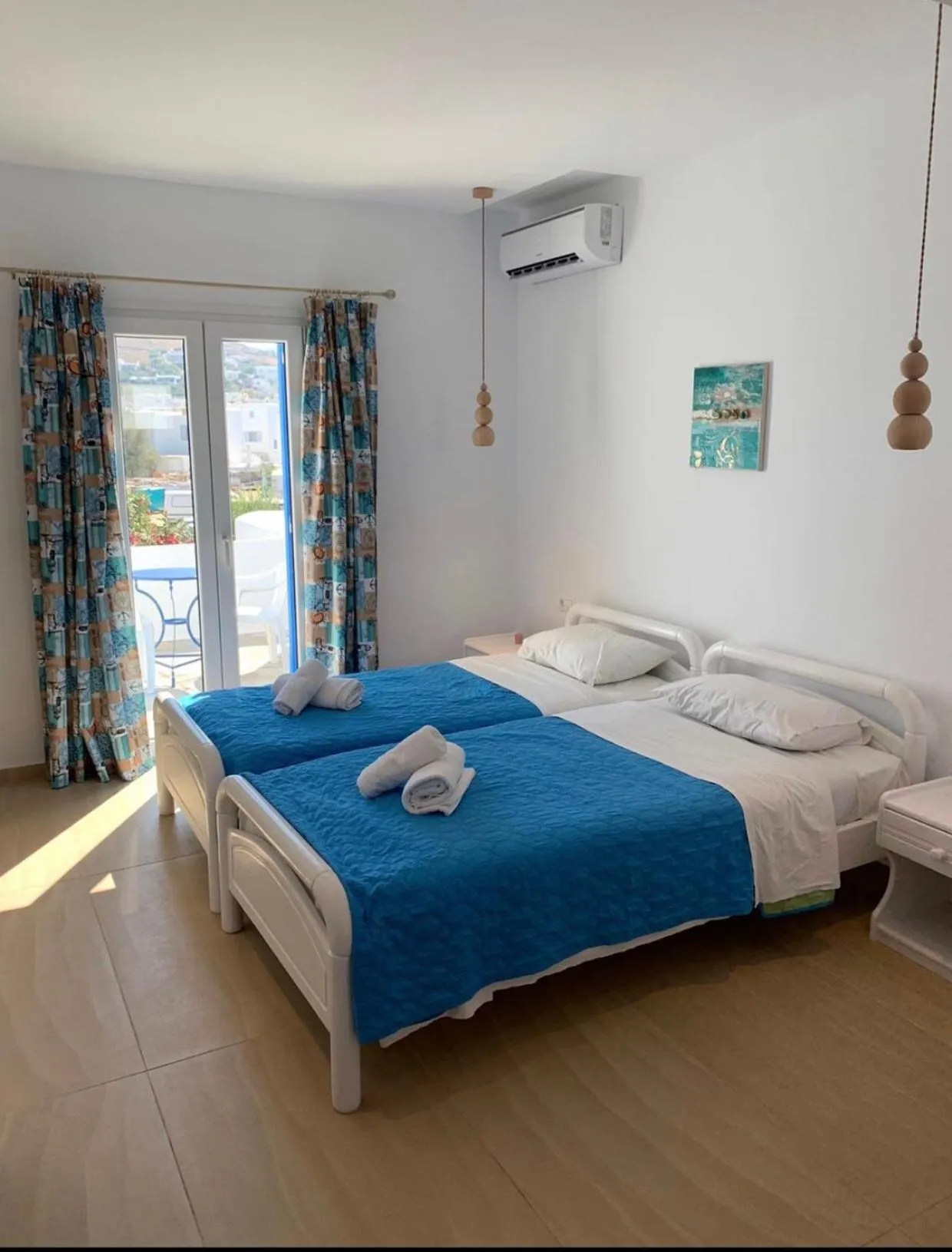Bed in Anemos Hotel & Apartments