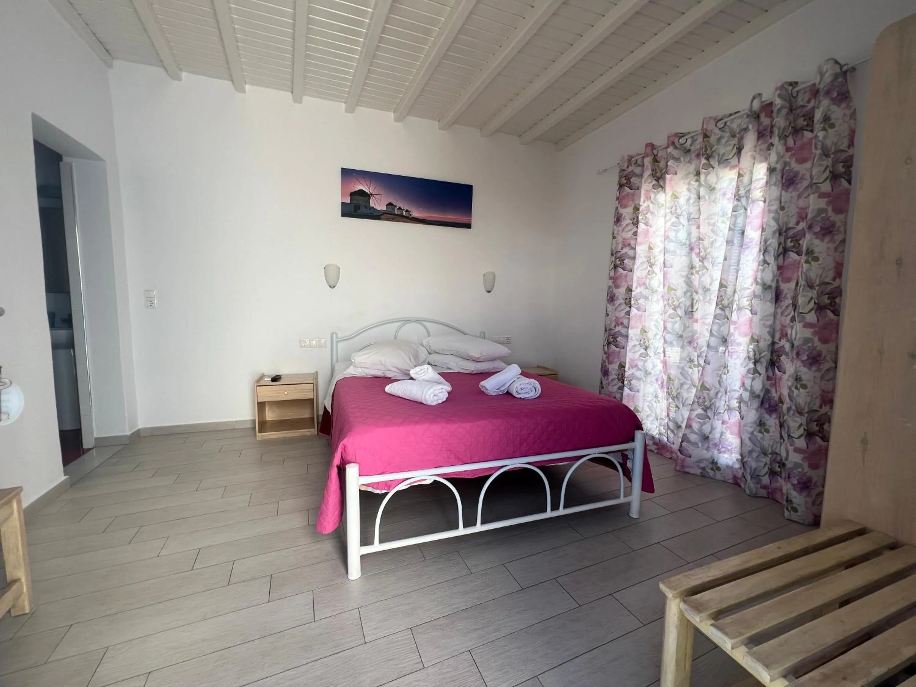 Bed in Anemos Hotel & Apartments