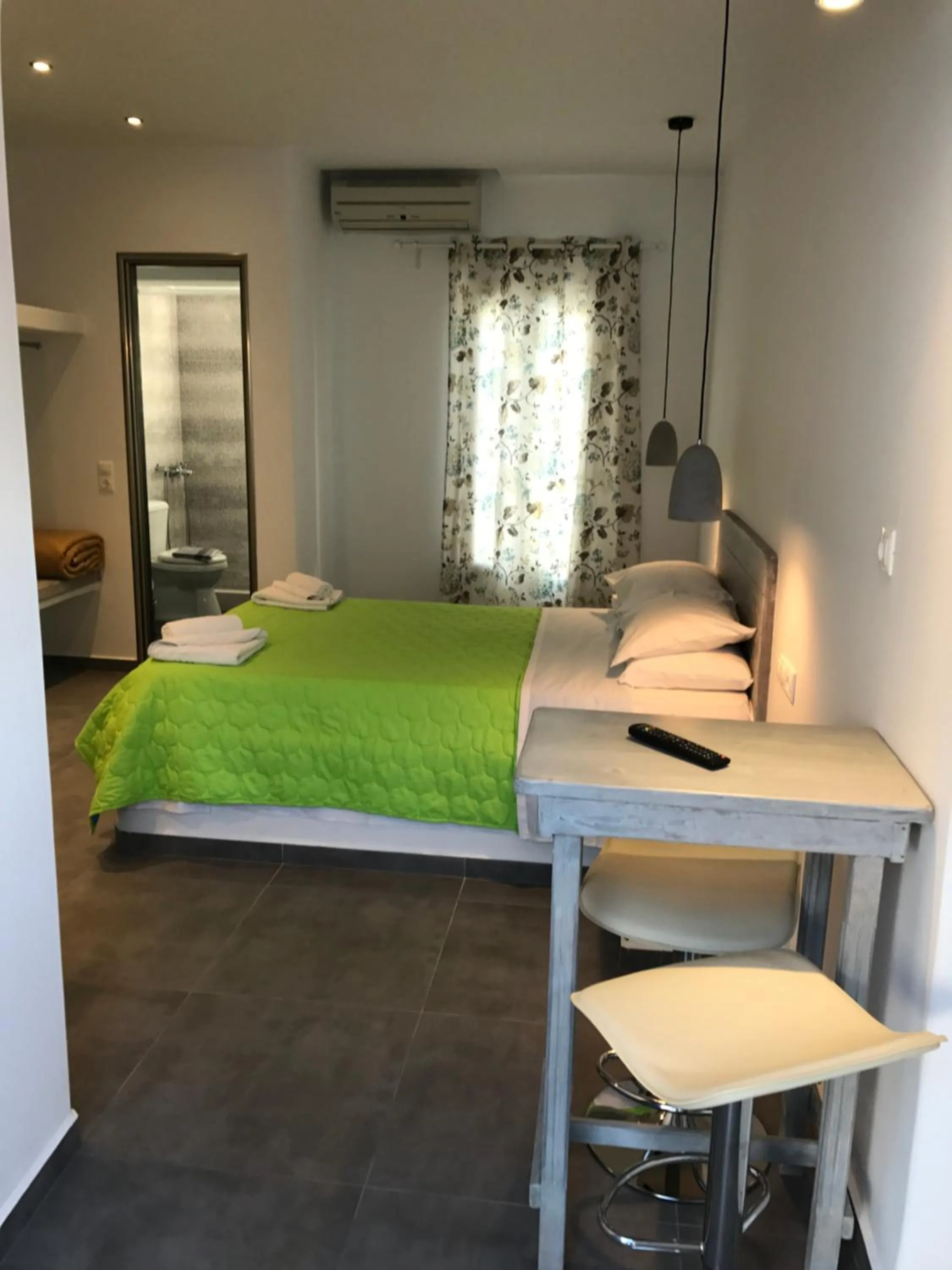 Bed in Anemos Hotel & Apartments