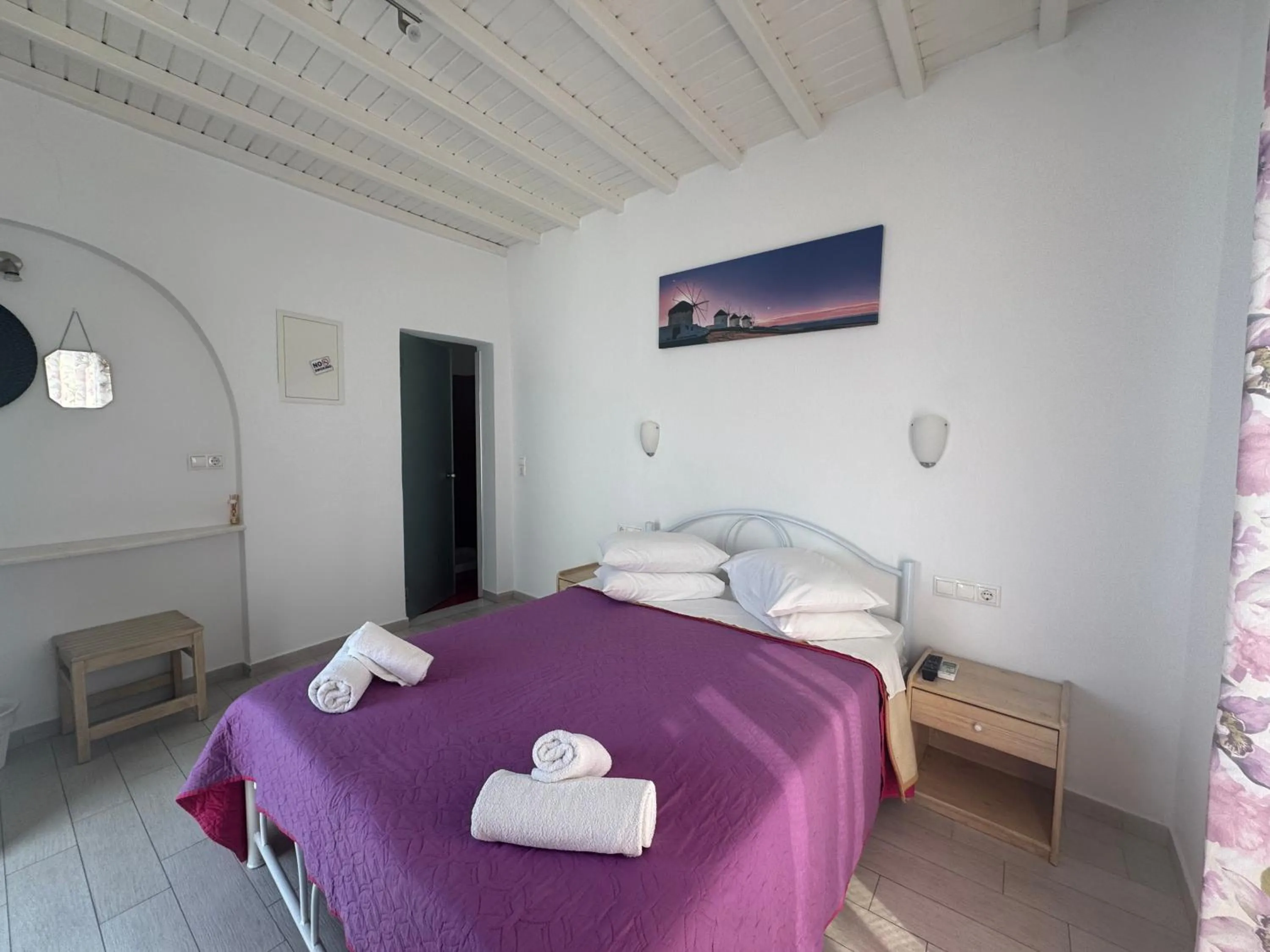 Bed in Anemos Hotel & Apartments
