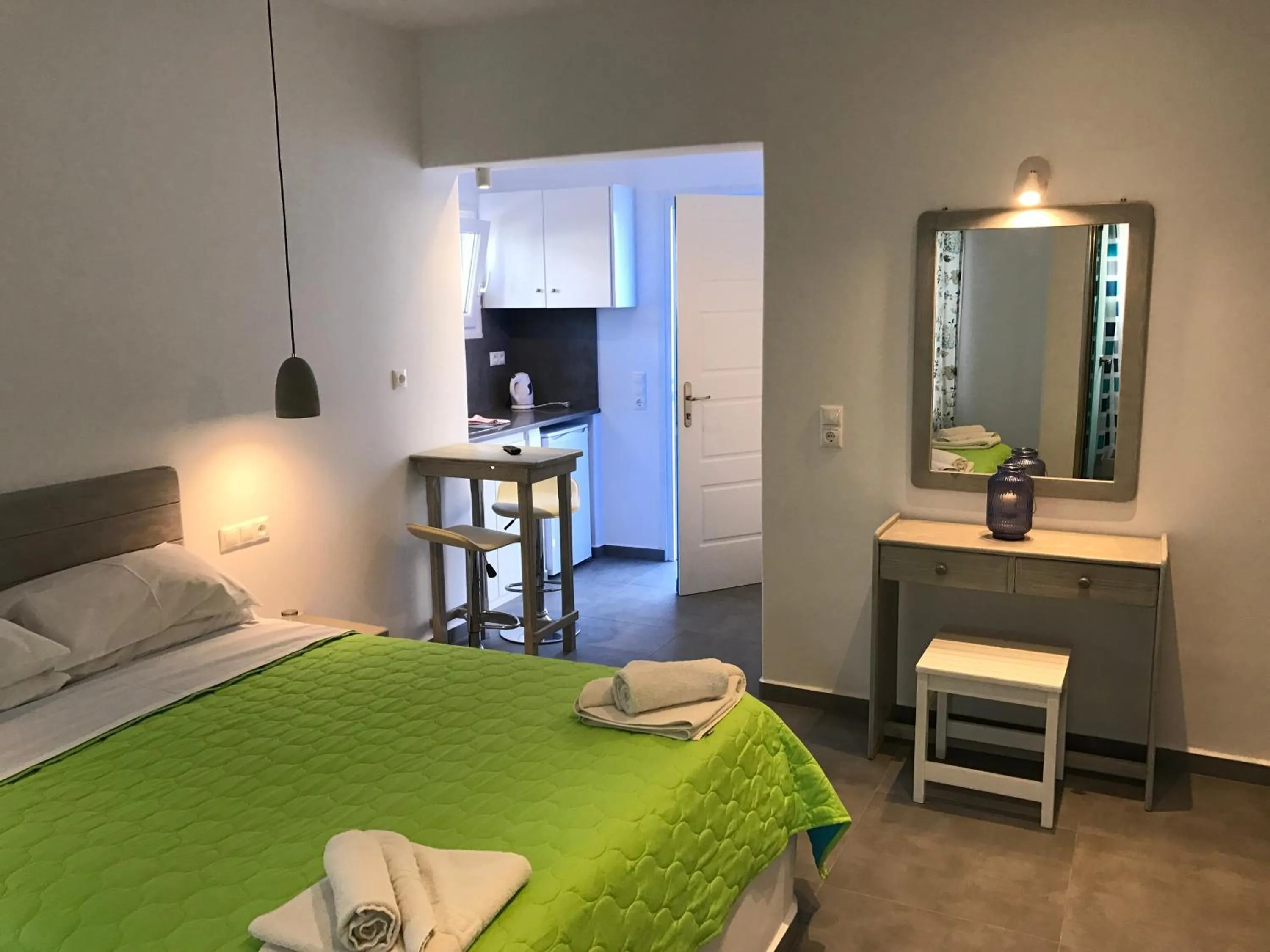 Bed in Anemos Hotel & Apartments