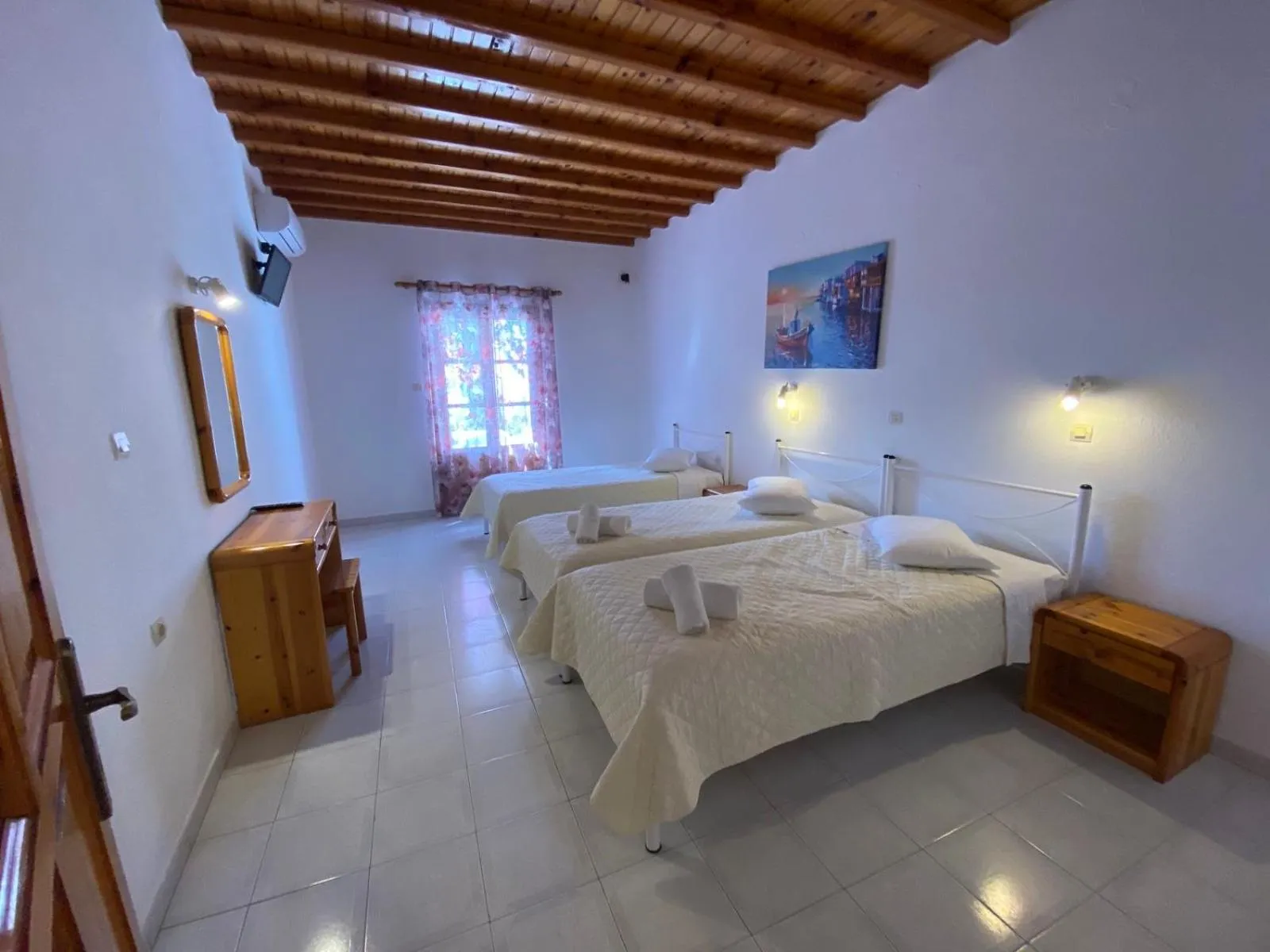 Bed in Anemos Hotel & Apartments