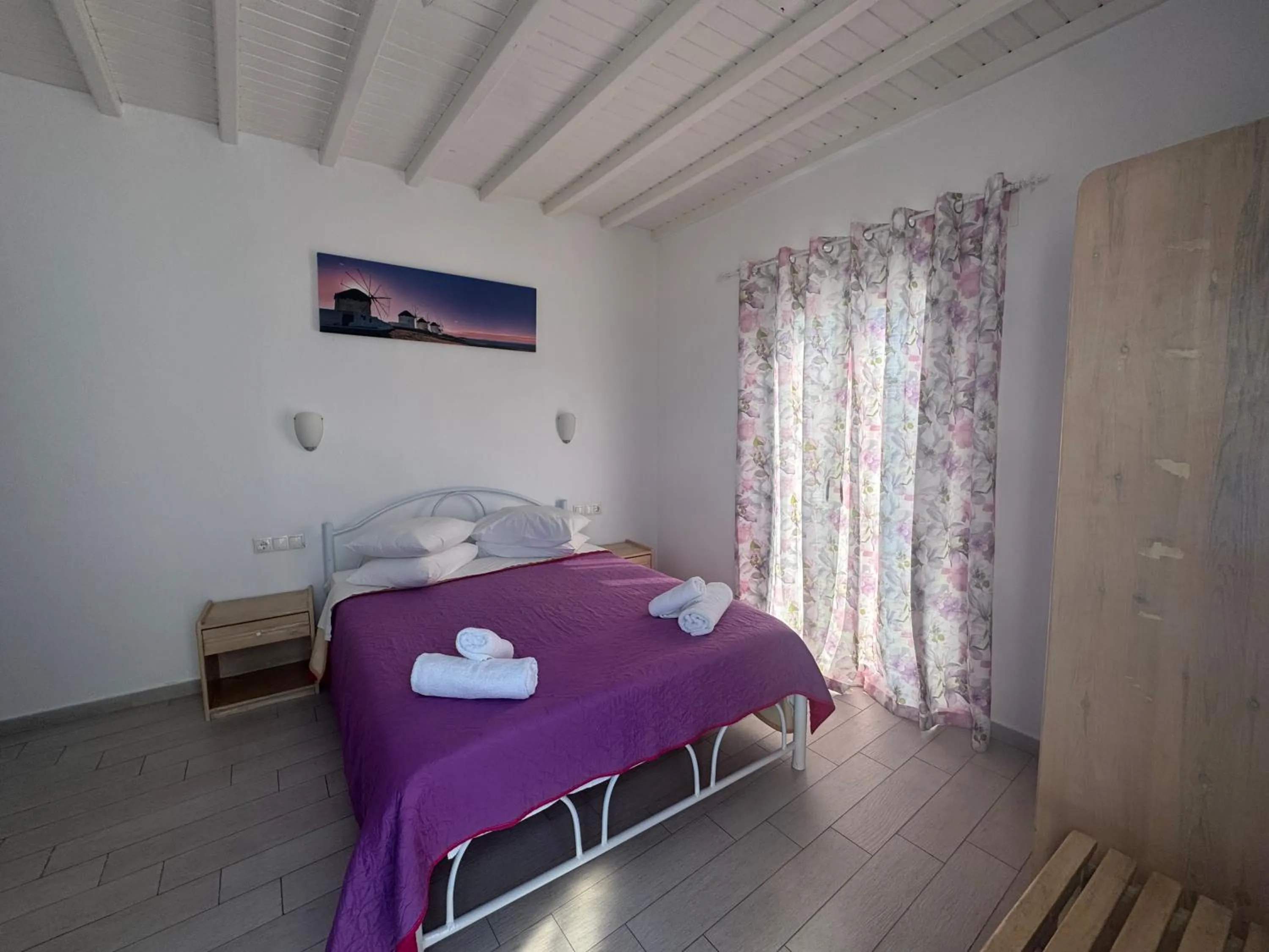 Bed in Anemos Hotel & Apartments