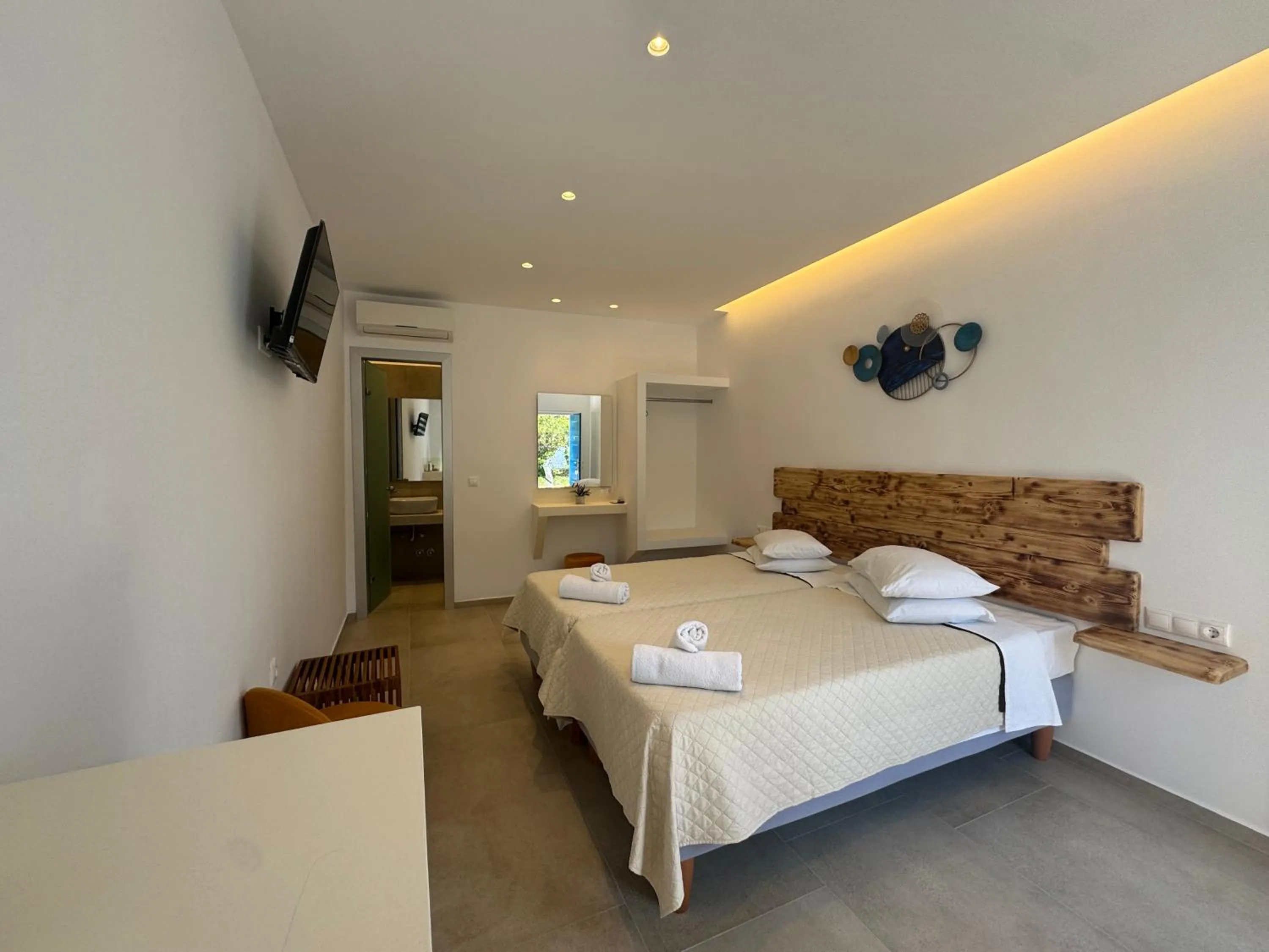 Bed in Anemos Hotel & Apartments