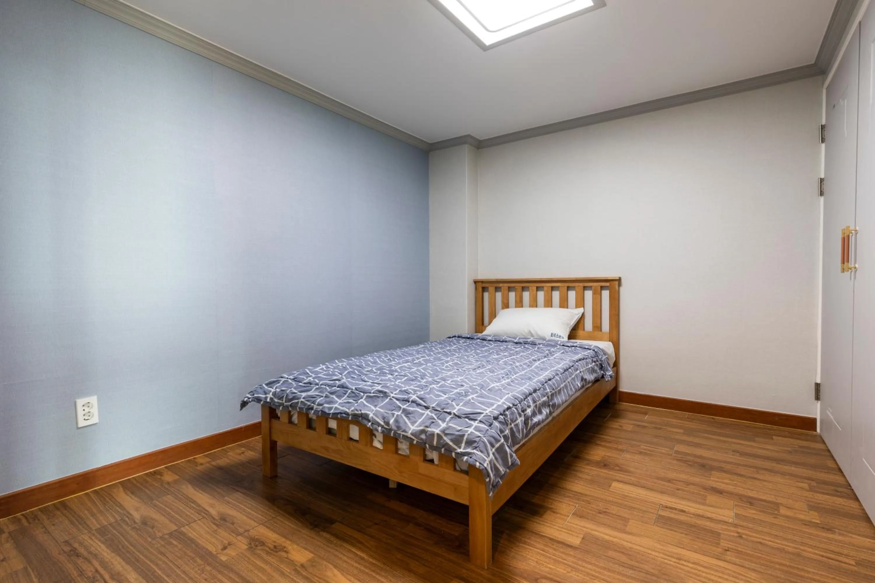 Bed in jeju Tovice Condo Ocean