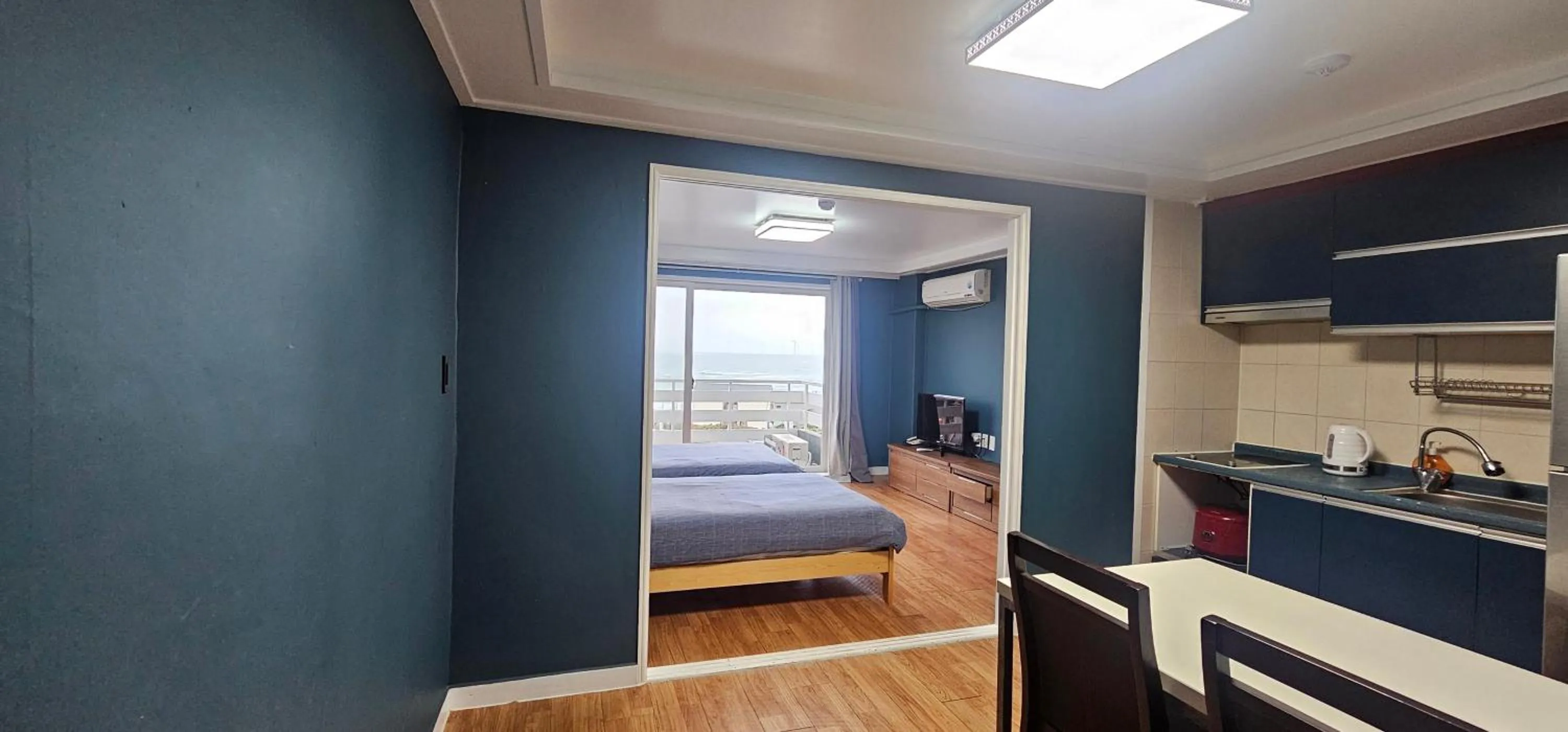 Bed in jeju Tovice Condo Ocean