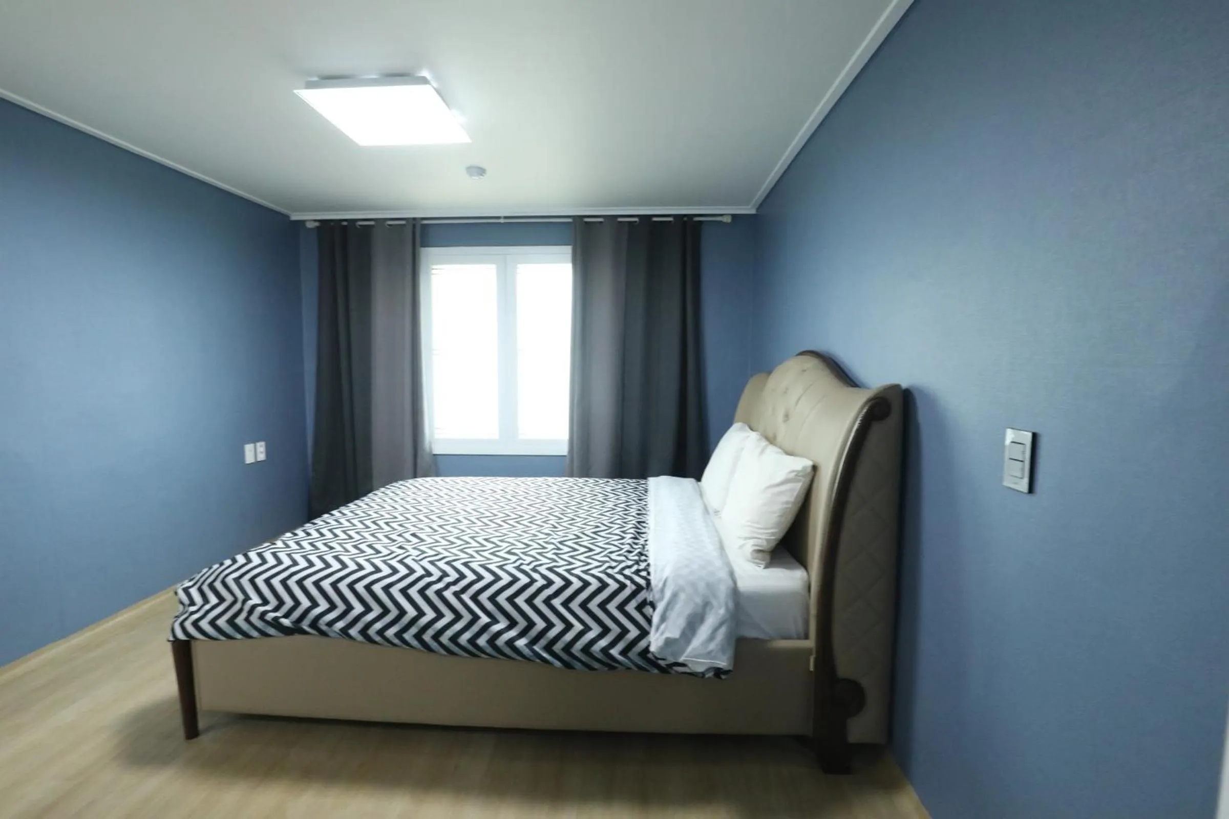 Bed in jeju Tovice Condo Ocean