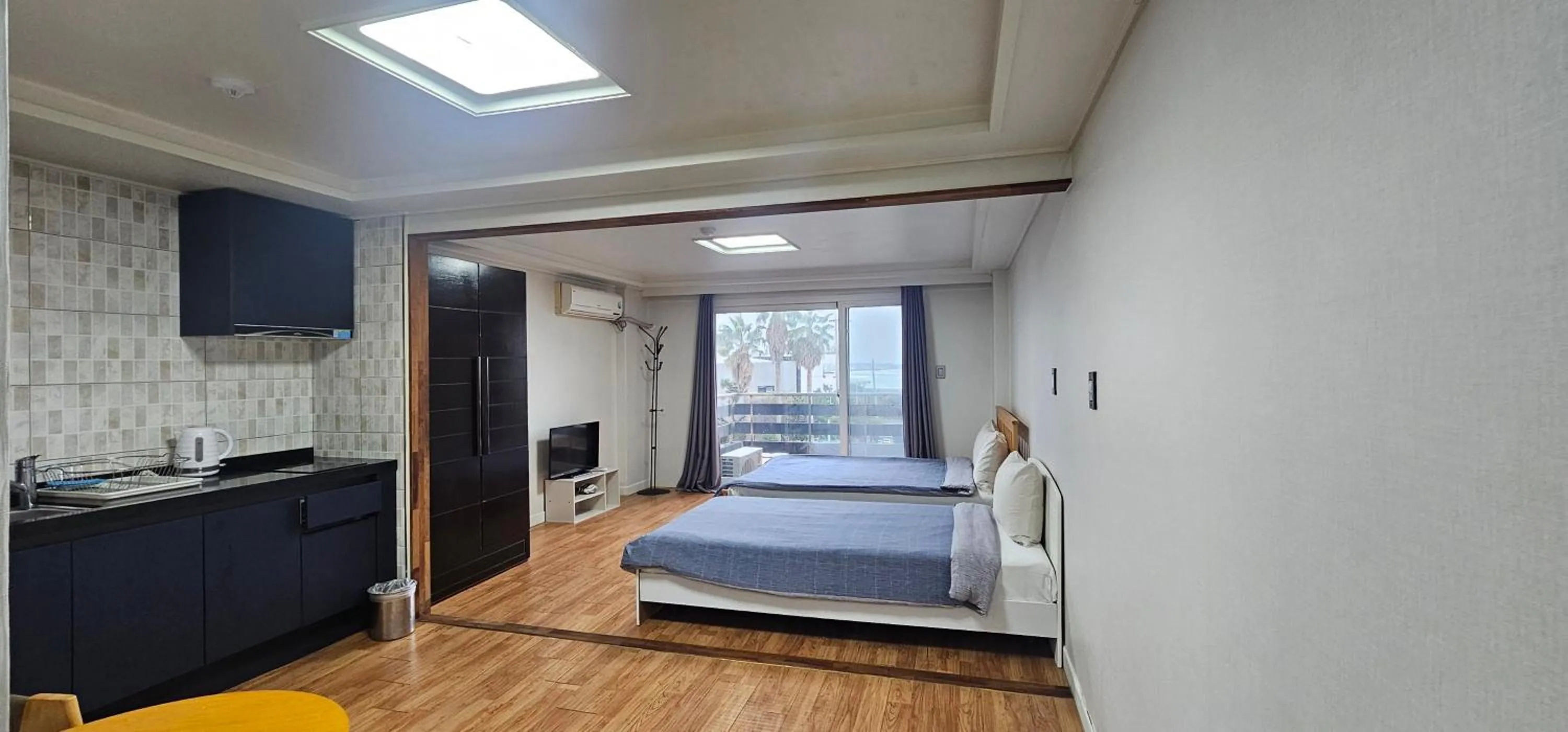 Bed in jeju Tovice Condo Ocean