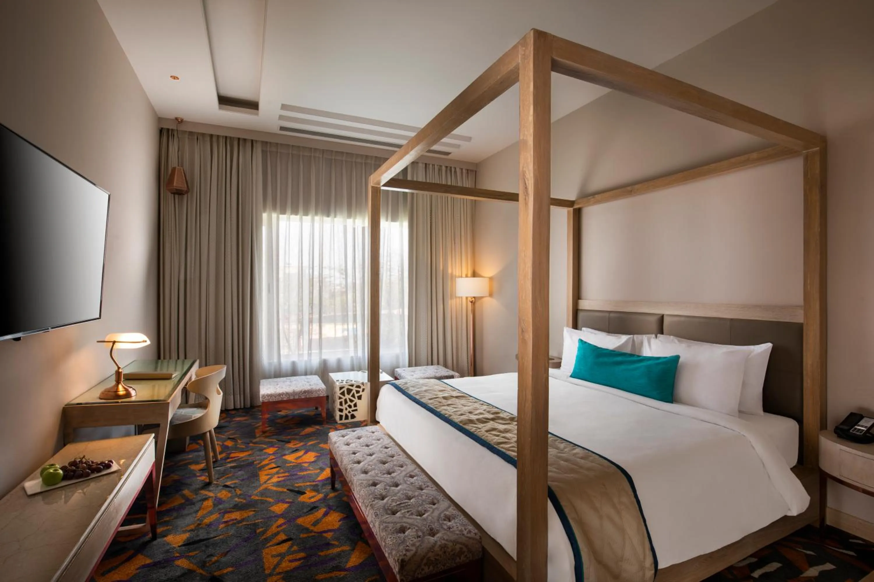 Communal lounge/ TV room, Bed in Sarovar Premiere Jaipur