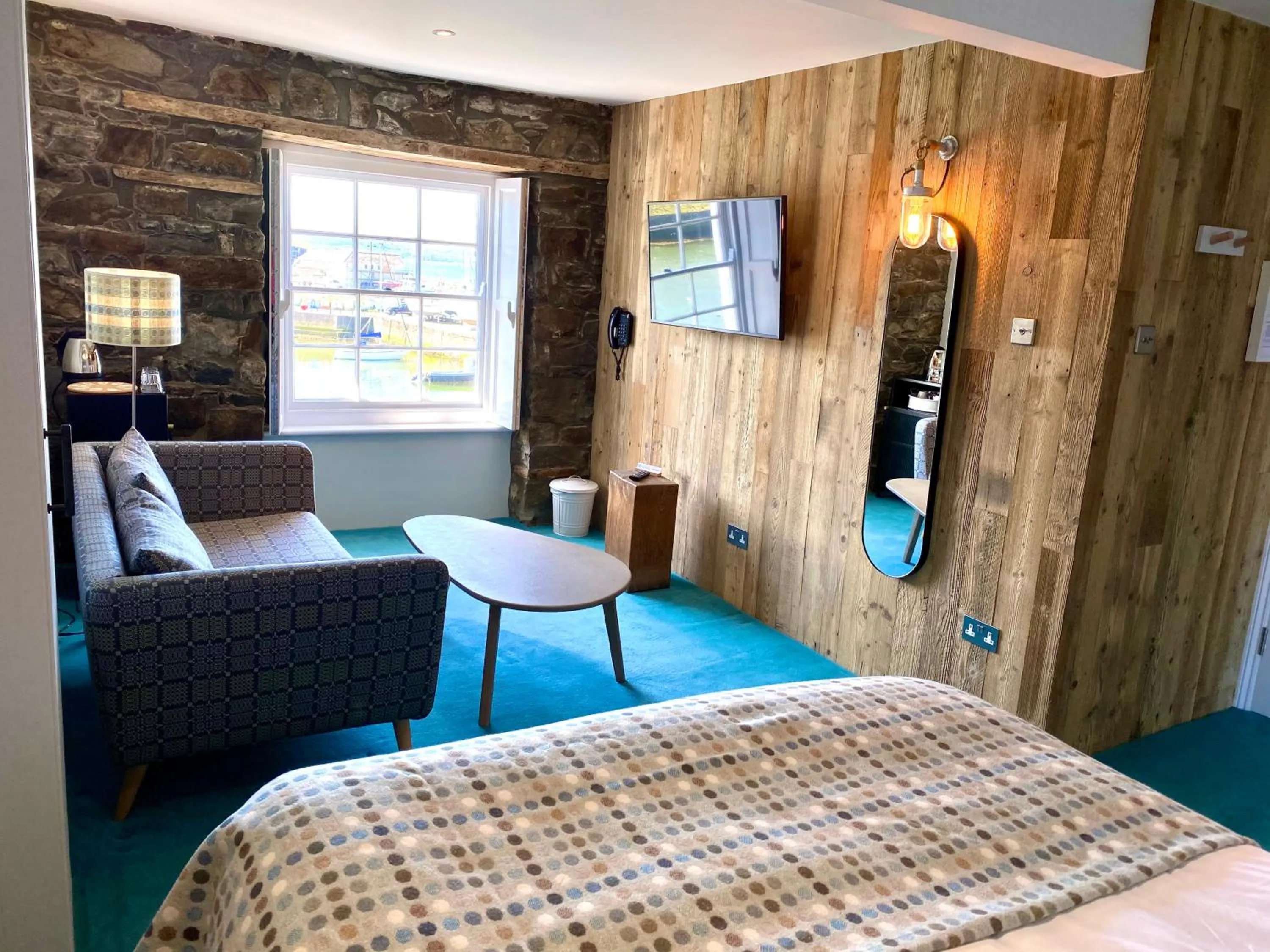 Seating area, Bed in Harbourmaster Hotel
