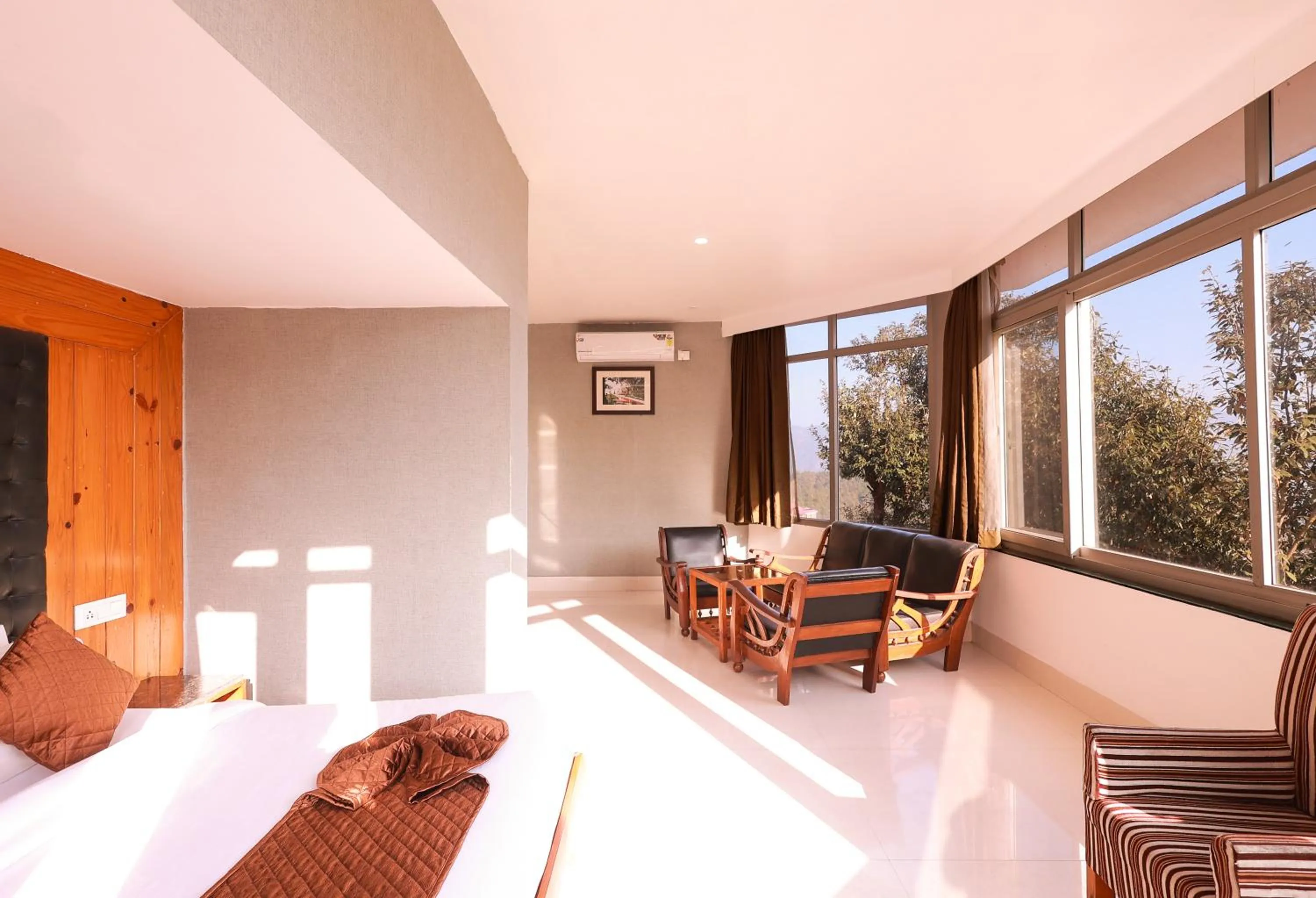 Seating area, Bed in Blue Pine Resort