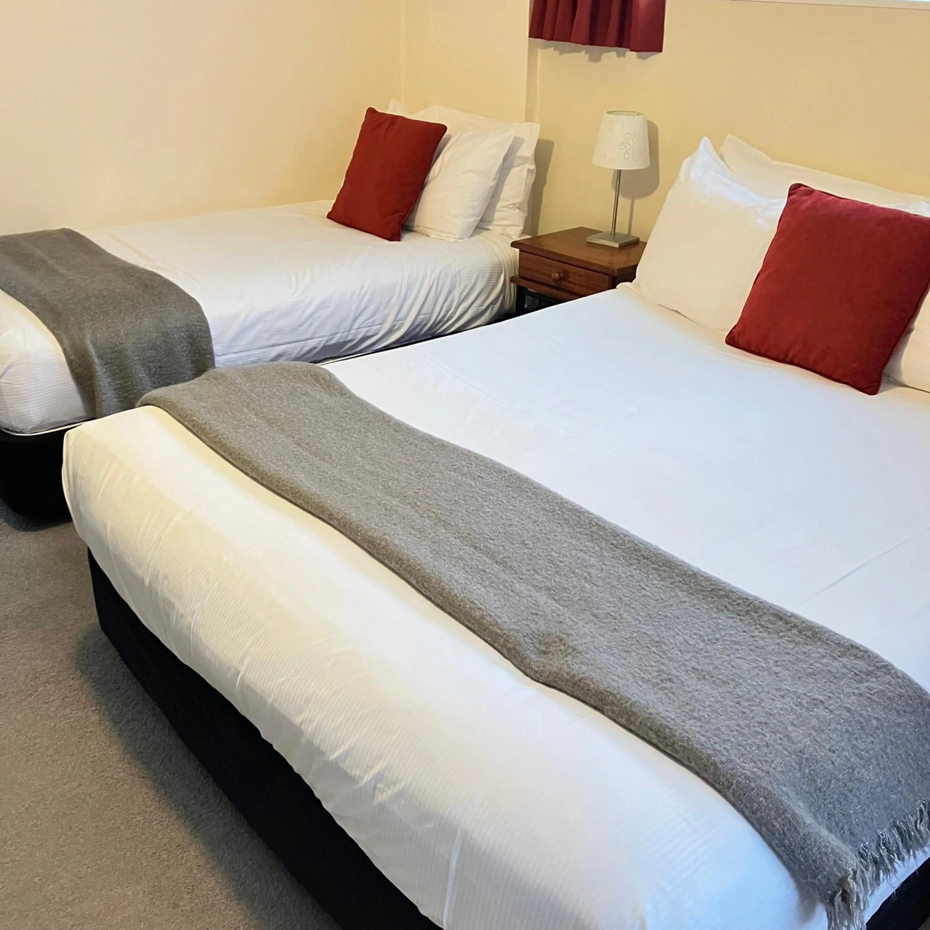 Bed in Kapiti Gateway Motel