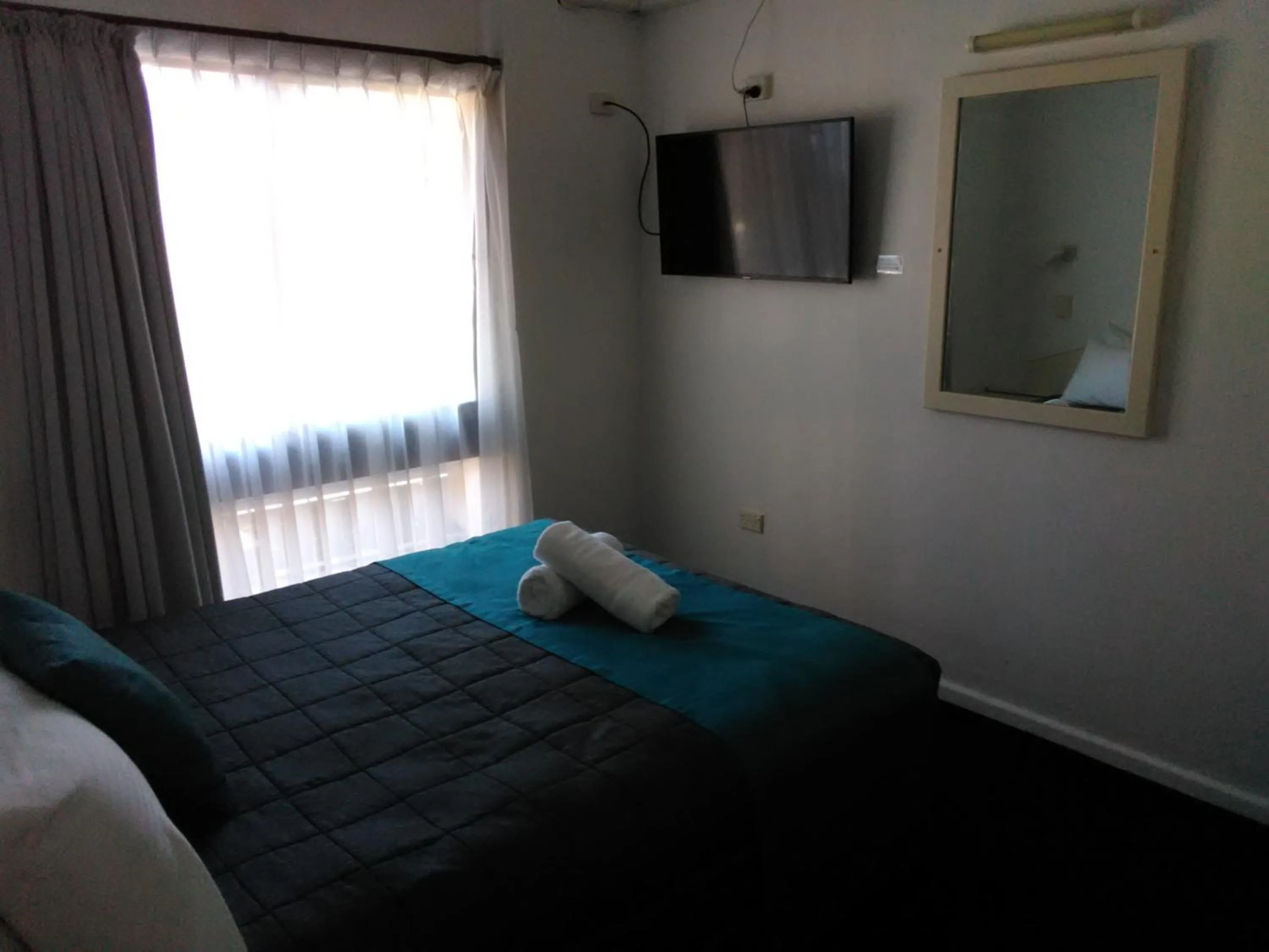 Bed in Caravilla Motor Inn