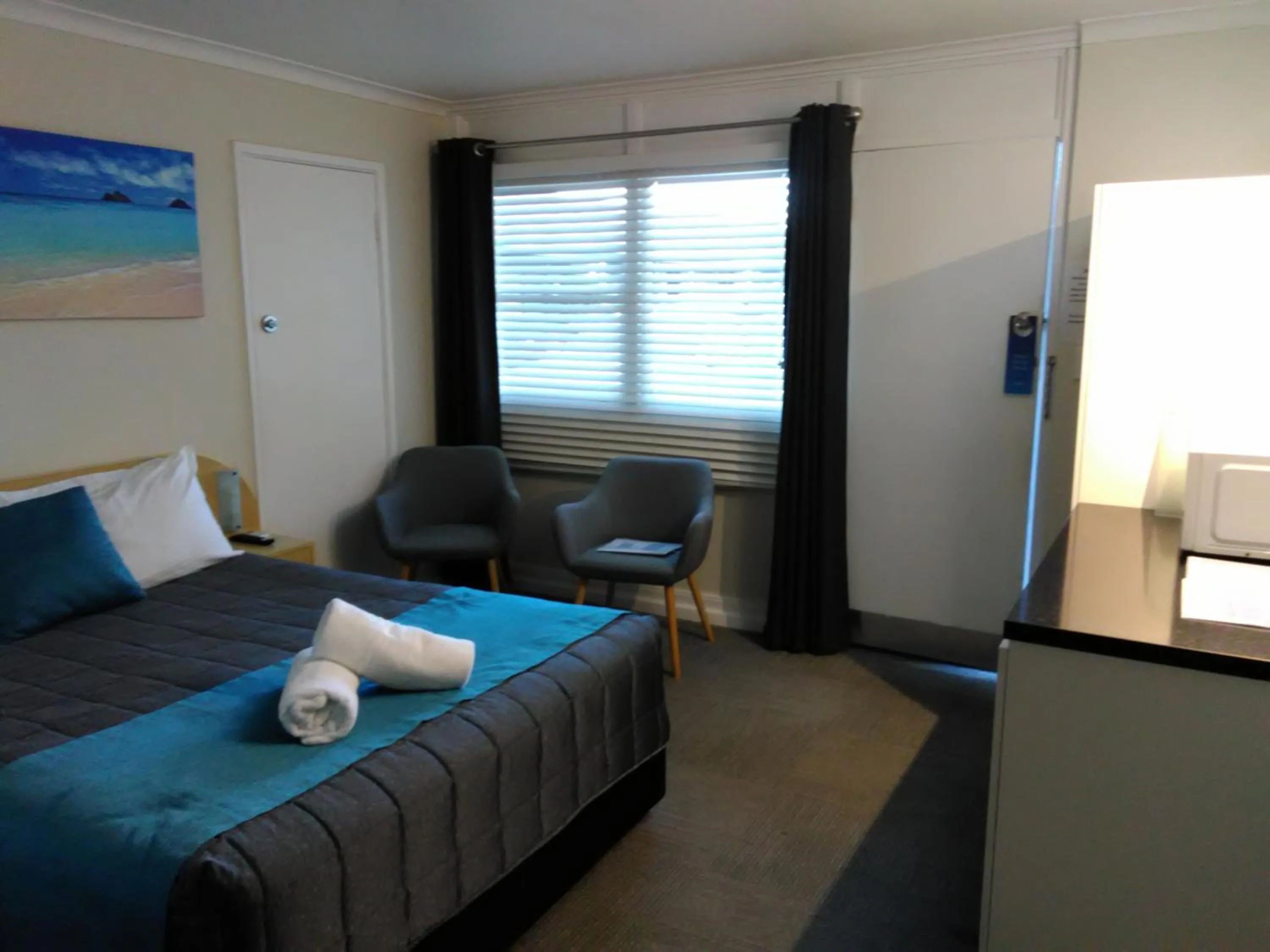 Bed in Caravilla Motor Inn