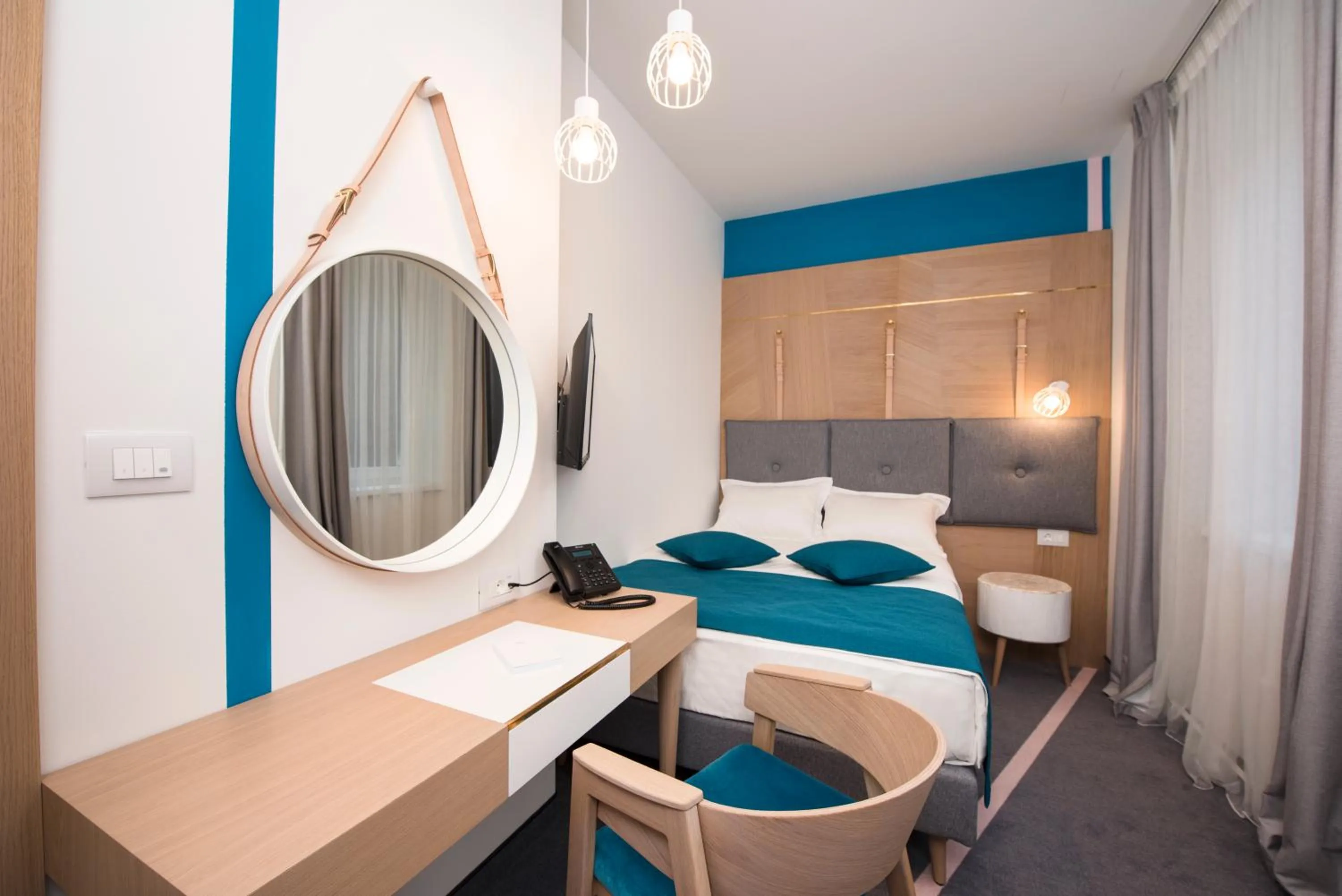 Bed in City Nest Modern & Cozy Suites