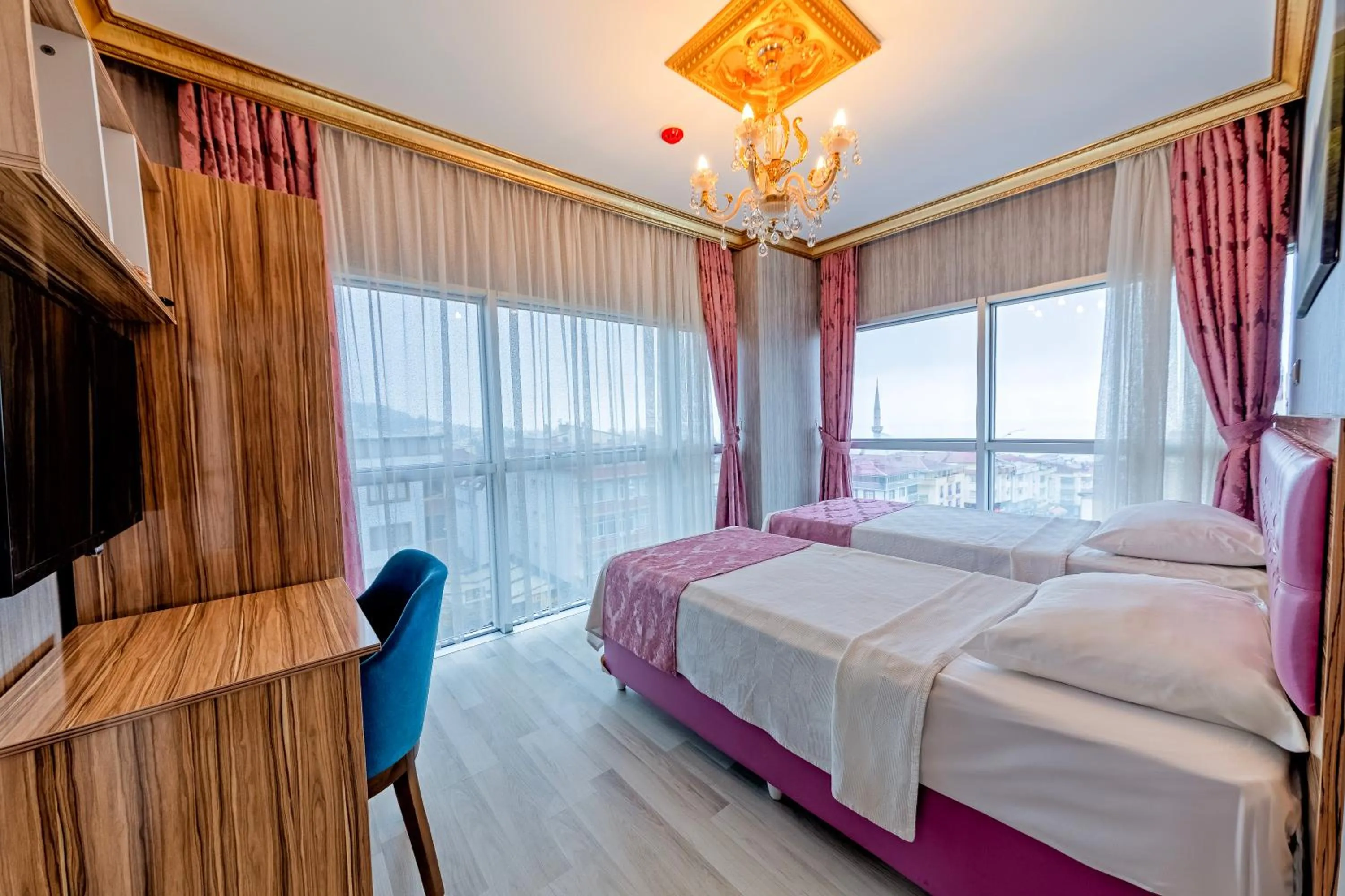 Bed in Royal Babil Suites Hotel