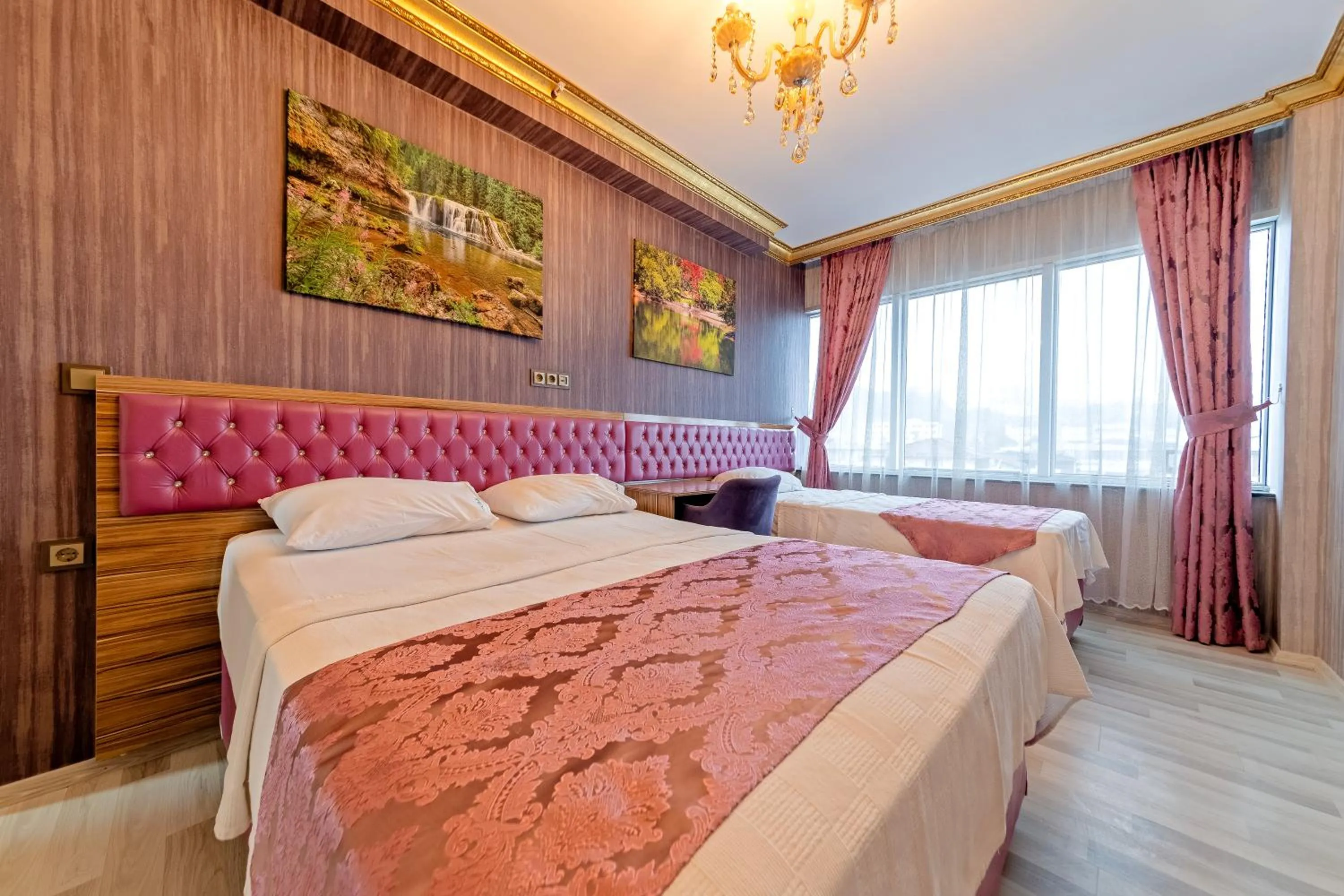 Bed in Royal Babil Suites Hotel
