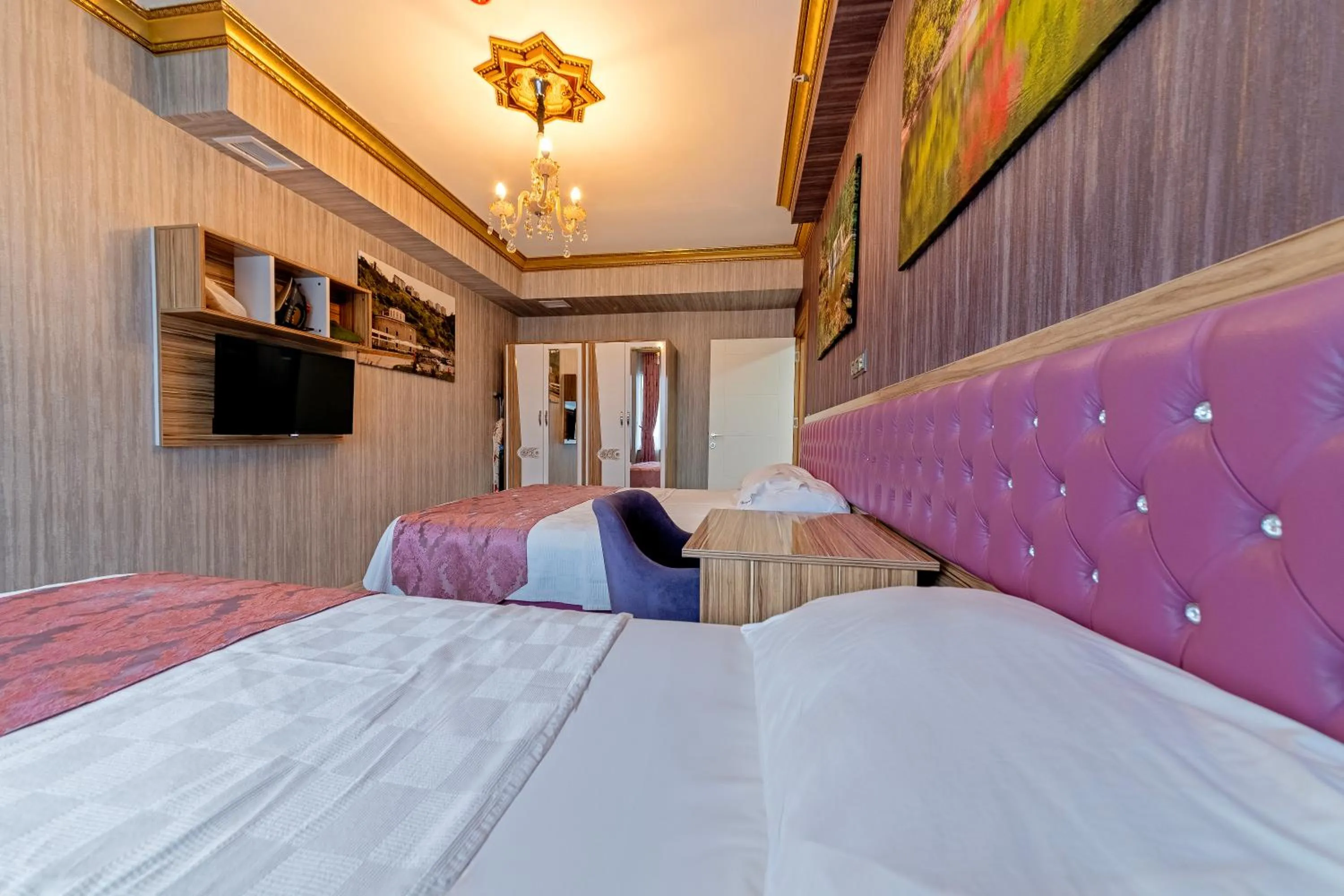 Bed in Royal Babil Suites Hotel
