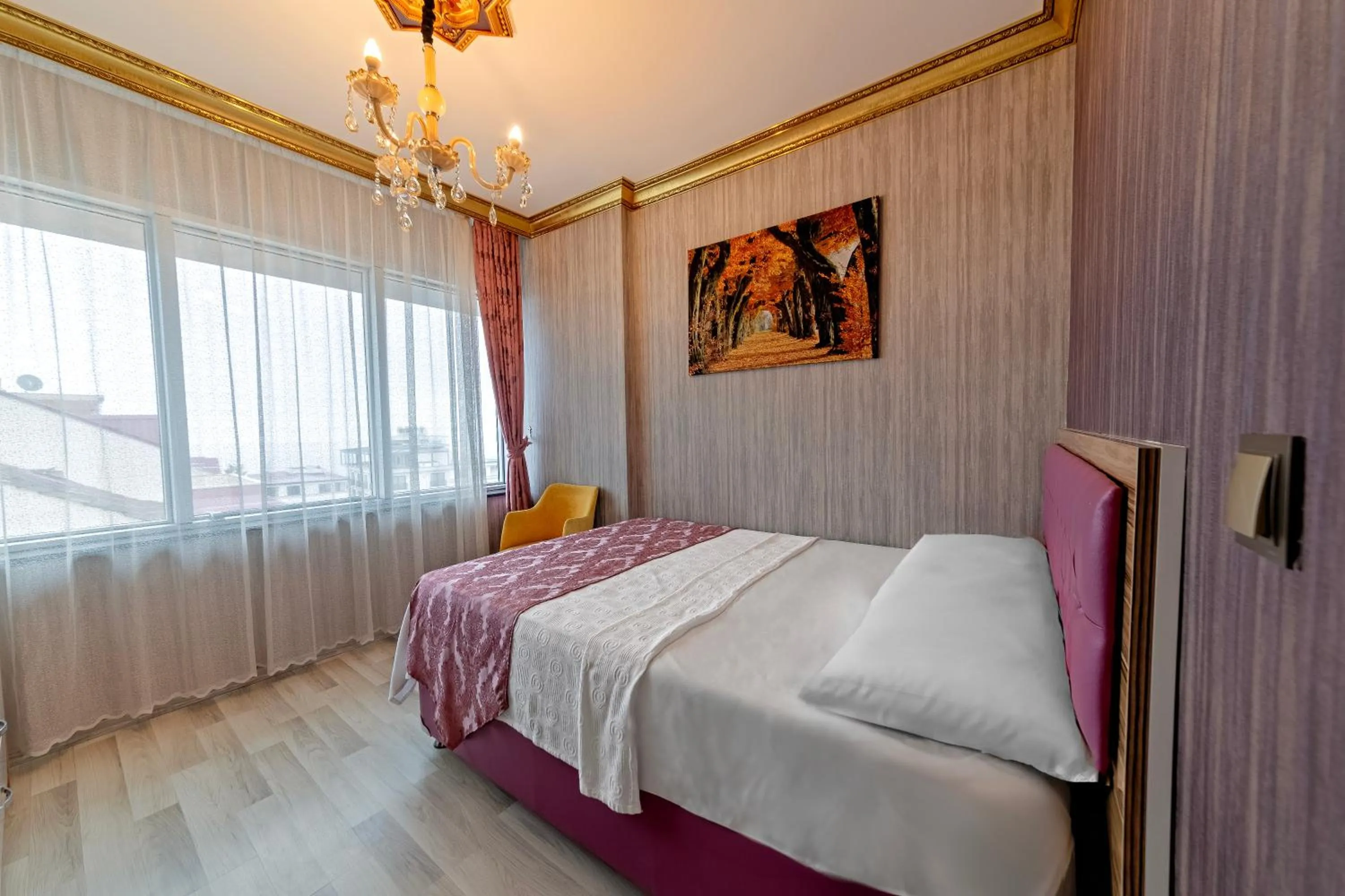 Bed in Royal Babil Suites Hotel