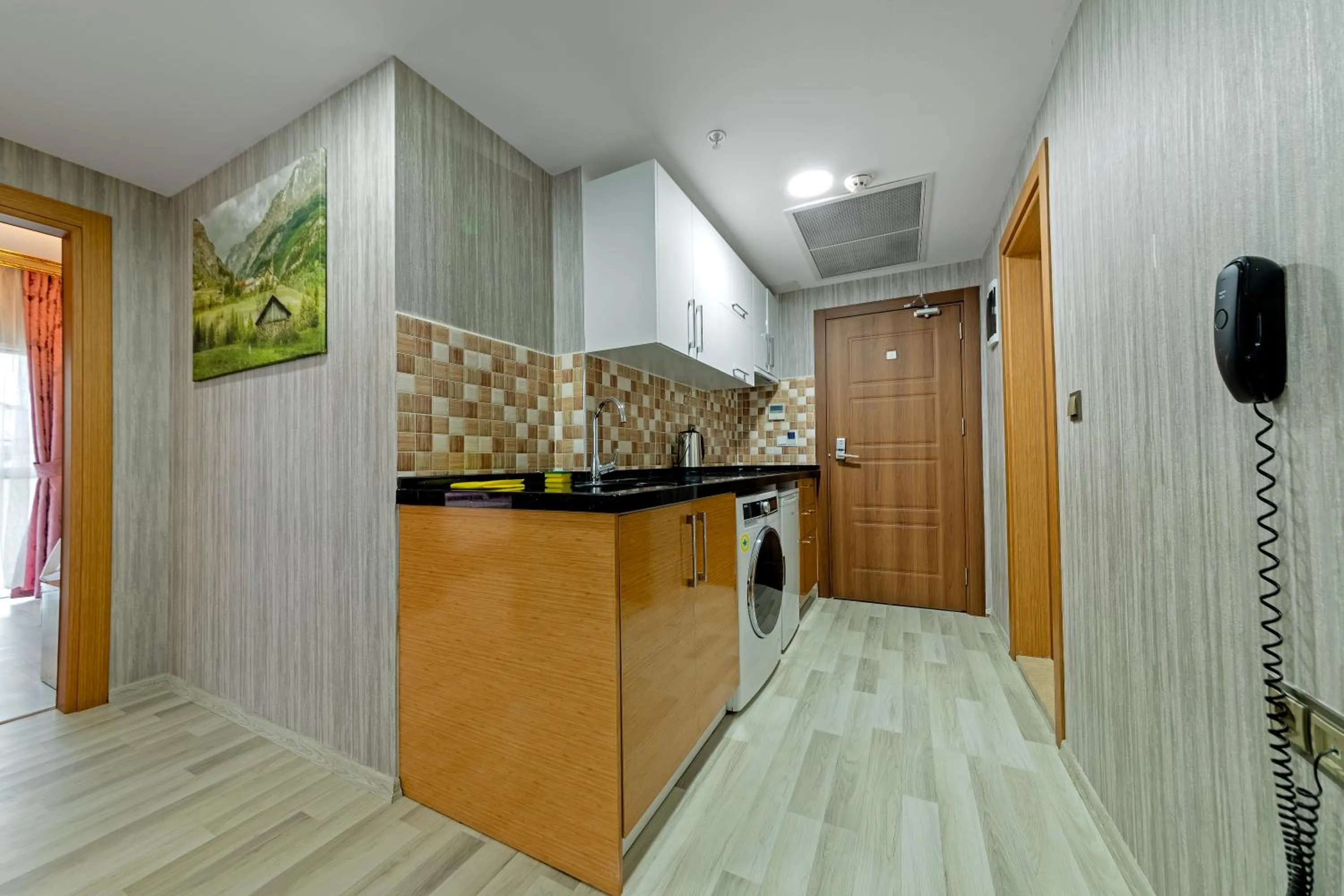 Kitchen or kitchenette in Royal Babil Suites Hotel