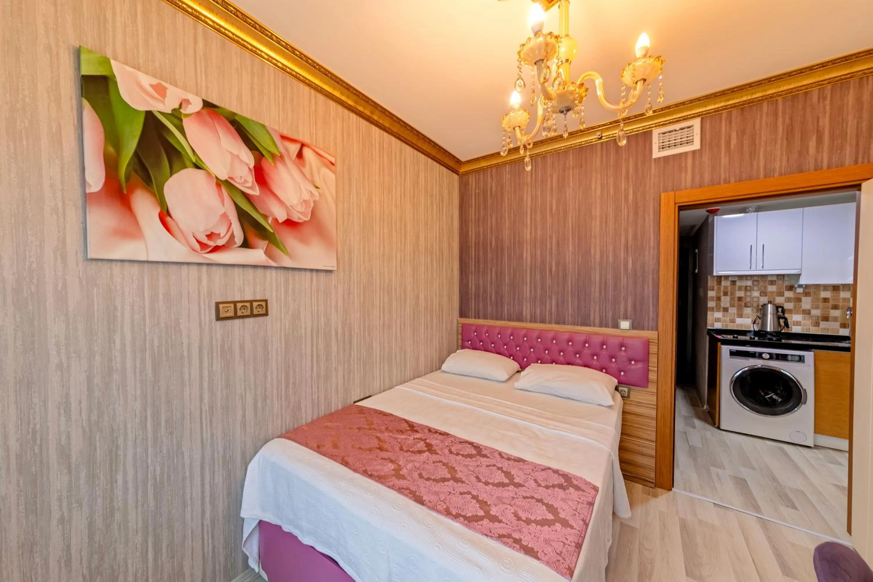 Bed in Royal Babil Suites Hotel