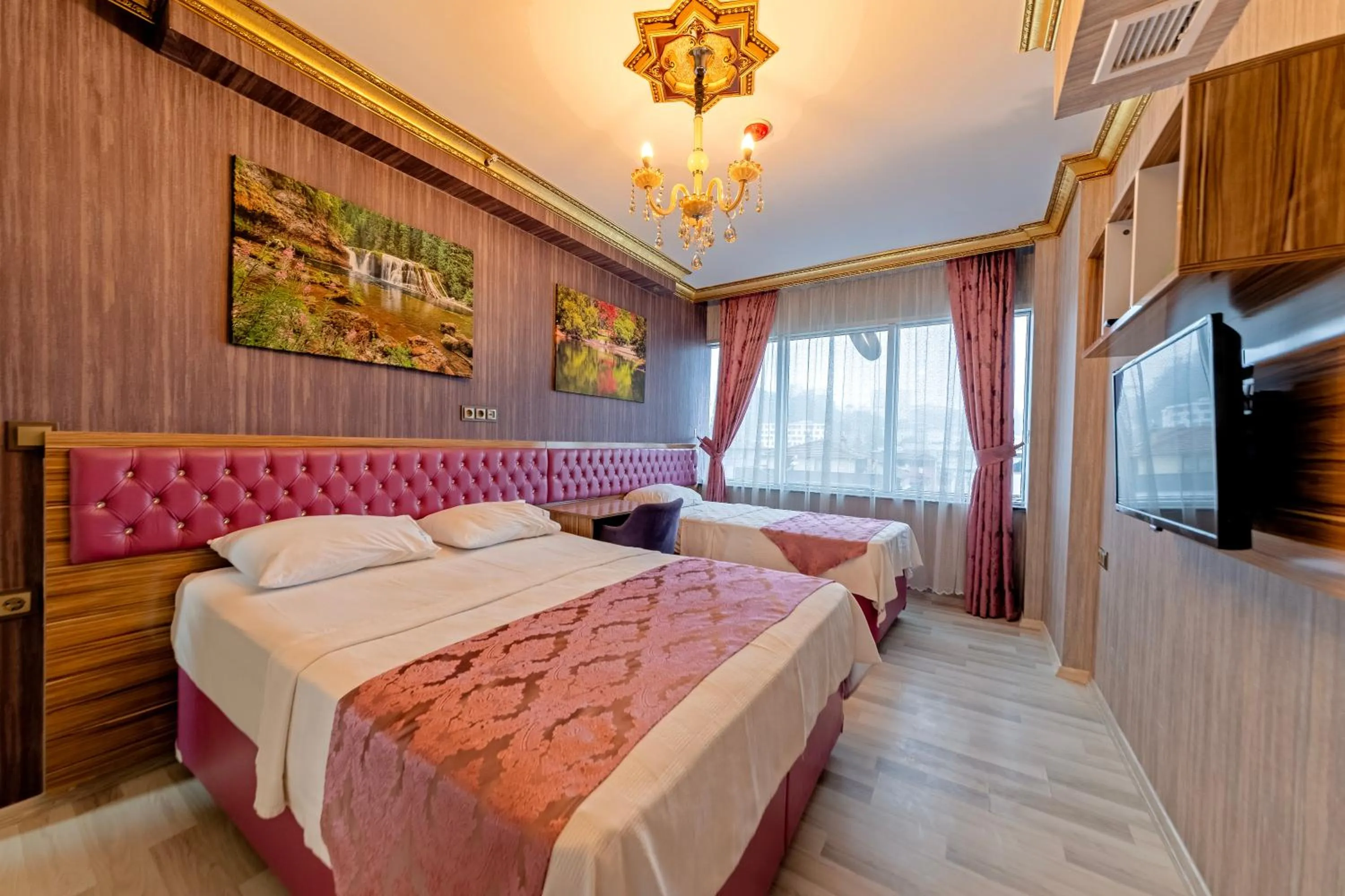 Bed in Royal Babil Suites Hotel