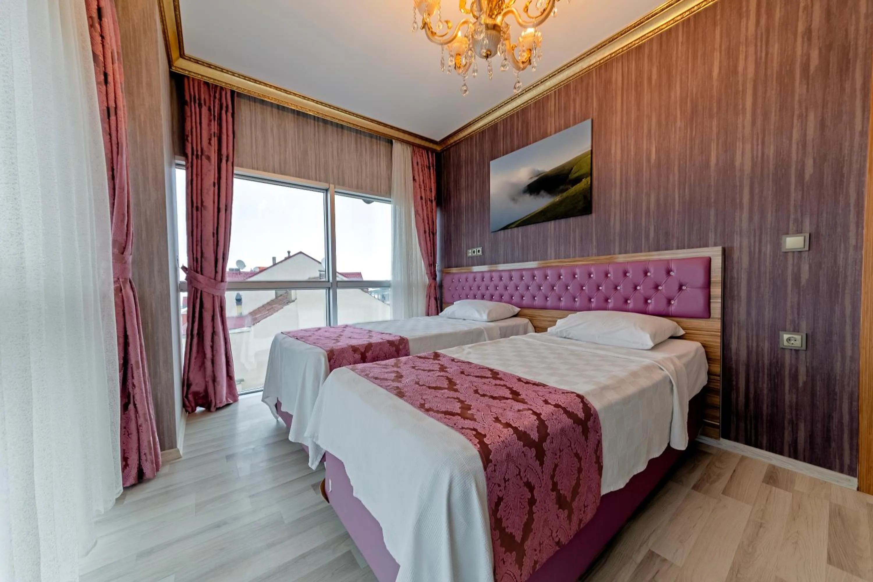 Bed in Royal Babil Suites Hotel