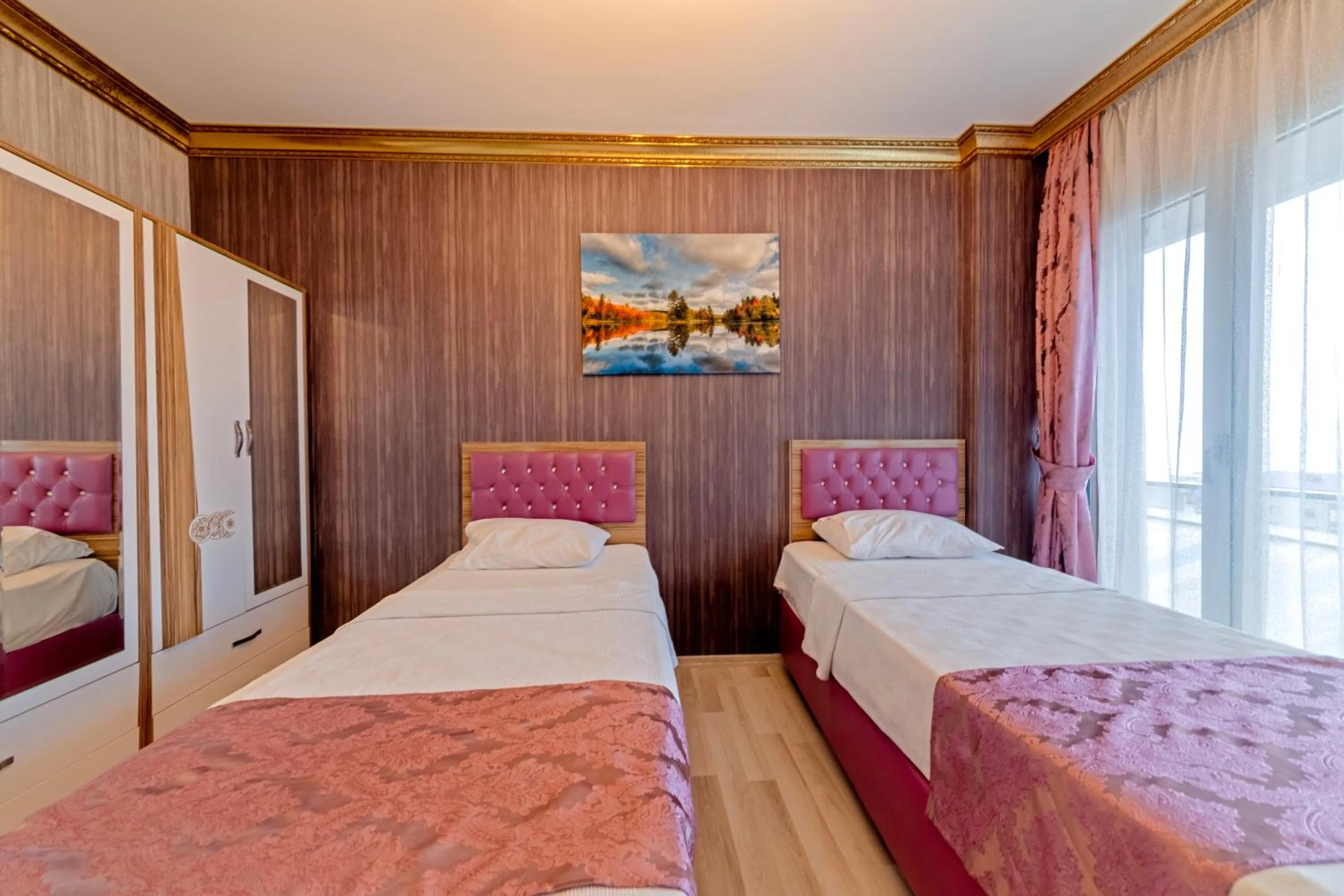 Bed in Royal Babil Suites Hotel