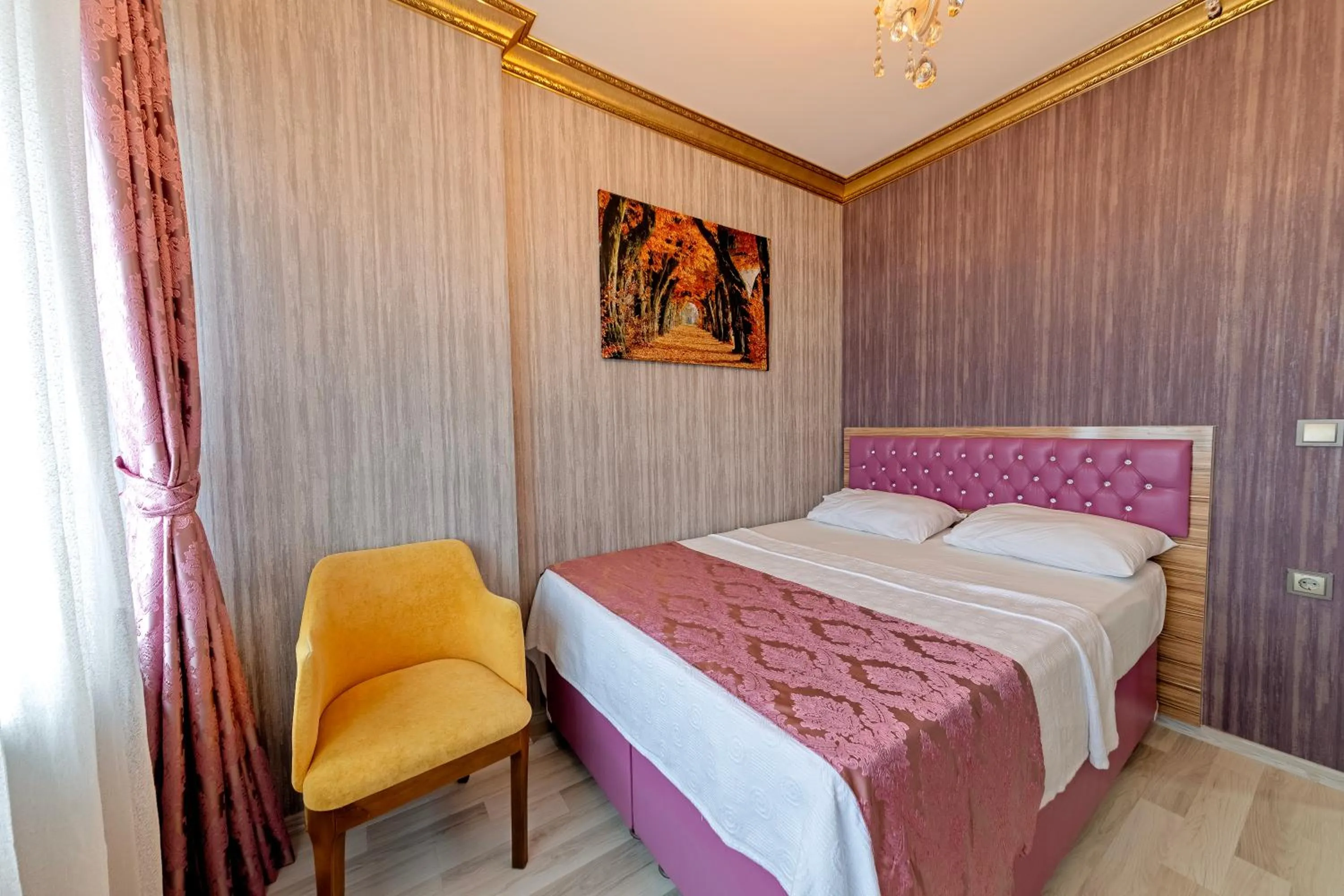 Bed in Royal Babil Suites Hotel